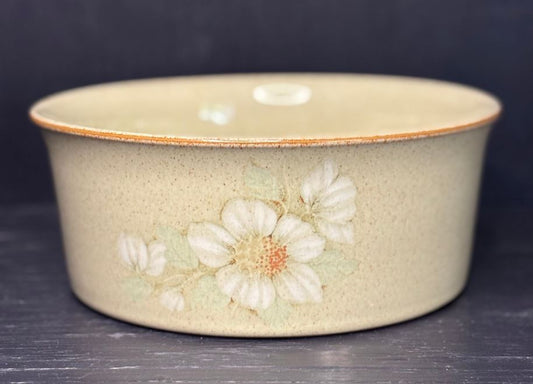Ceramic bowl with floral design on a dark background