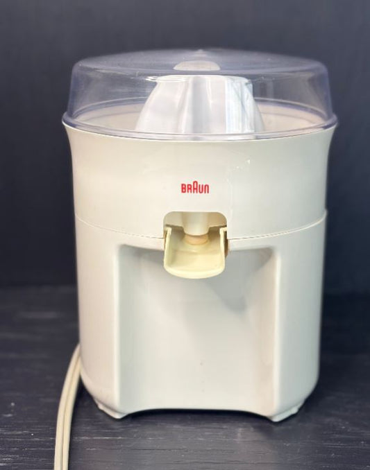 Braun kitchen appliance on a dark surface
