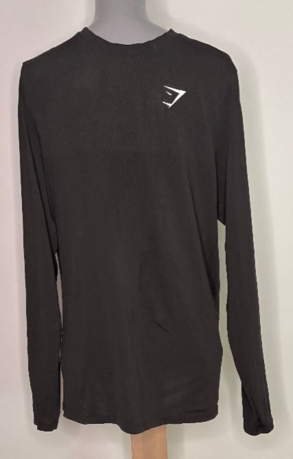 Black long-sleeve shirt with a logo on a mannequin against a white background