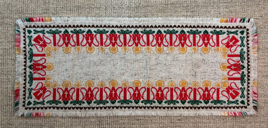 Decorative woven mat with intricate patterns on a textured surface