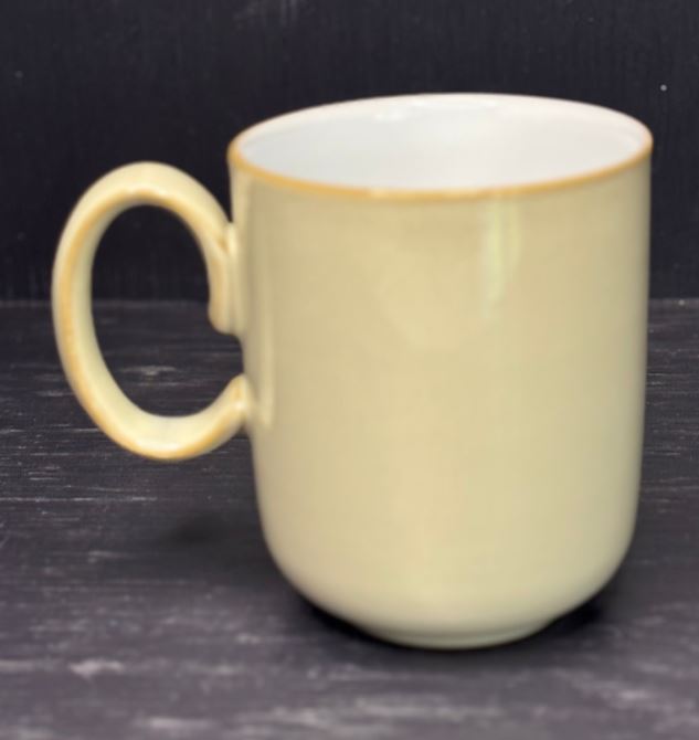 Beige mug on a dark surface