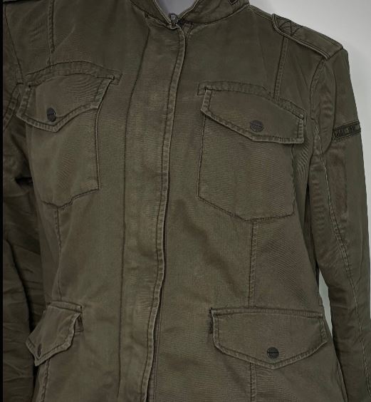 Green jacket with multiple pockets on a plain background
