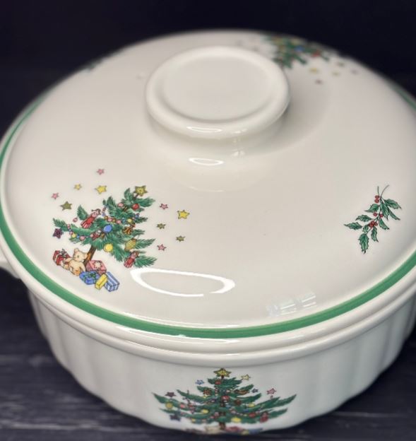 Ceramic dish with Christmas tree design on a dark background