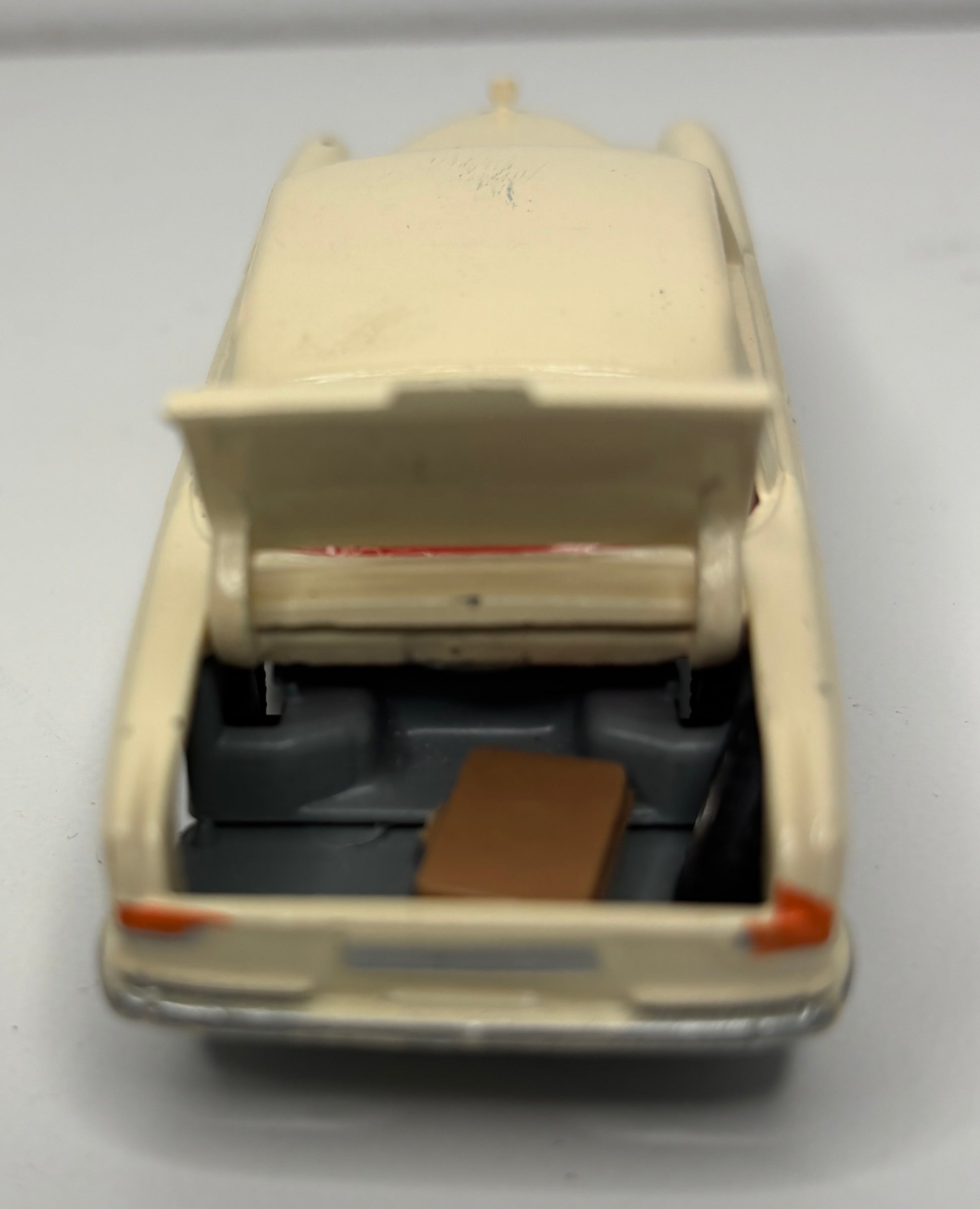 Model of a vintage truck with an open cargo area on a gray background