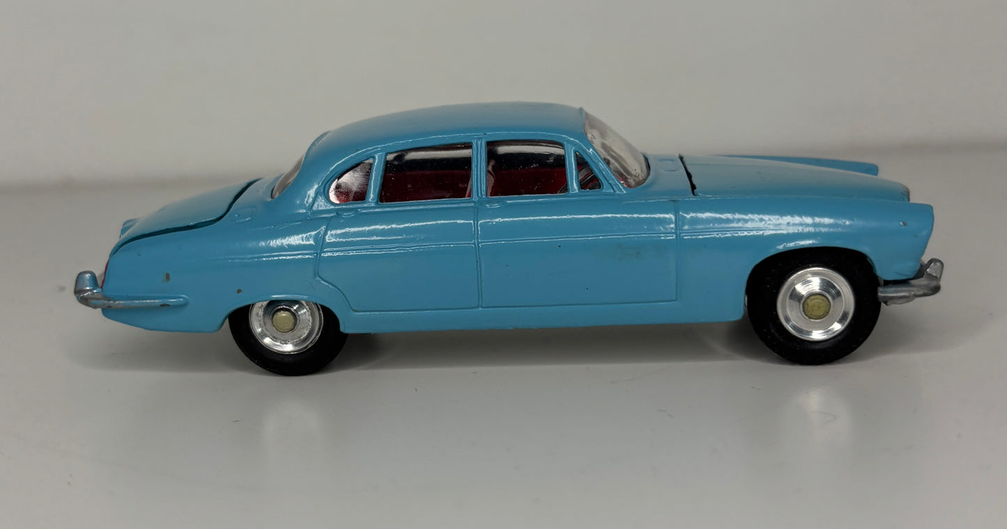 Model of a blue vintage car on a gray background