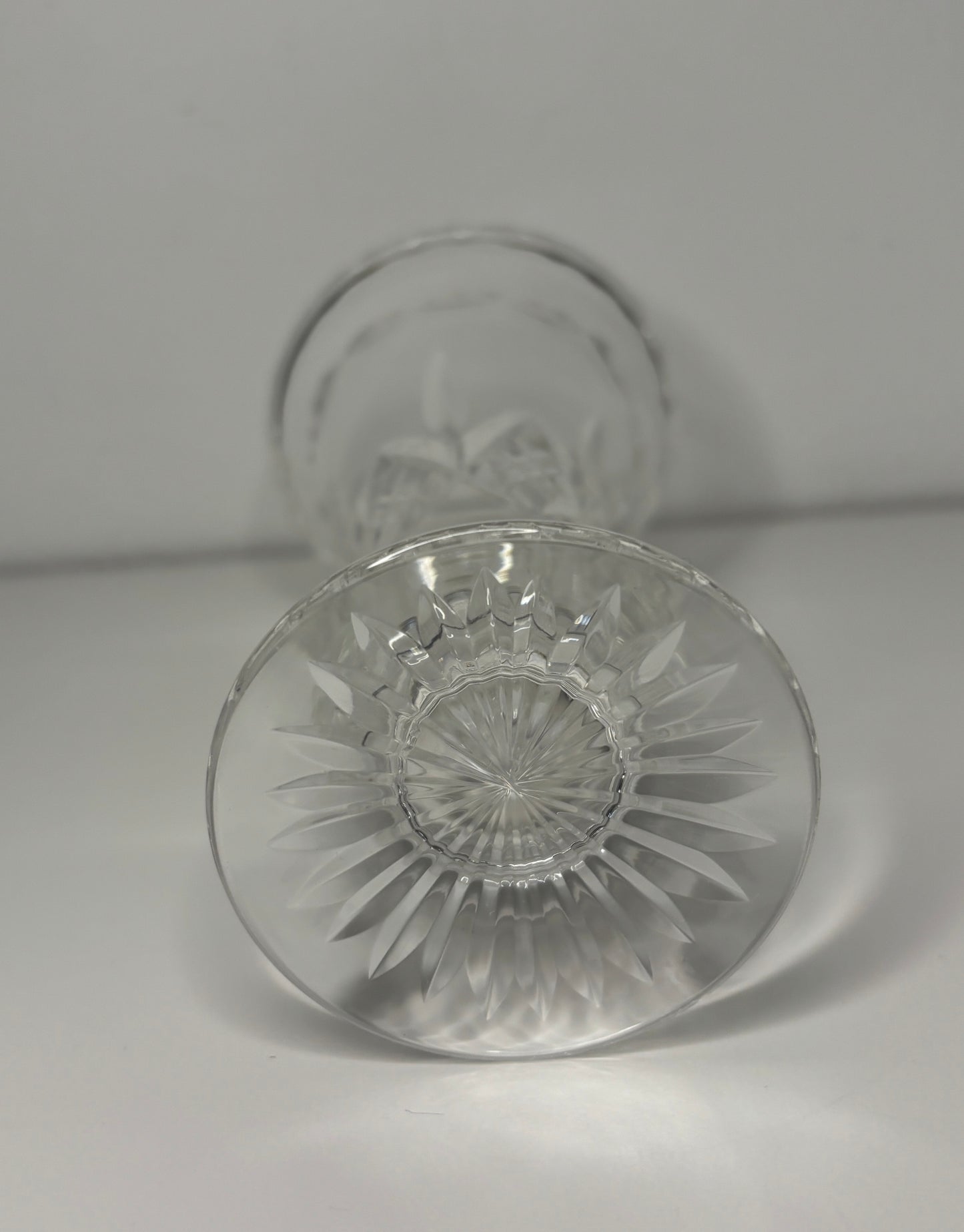 Clear glass with intricate design on a light gray background