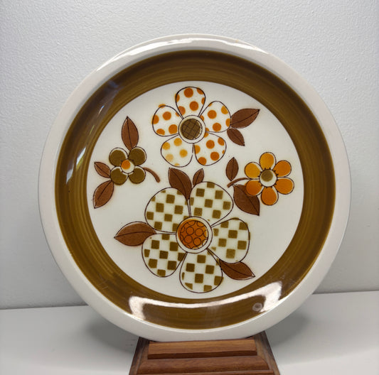 Decorative plate with floral design on a white background