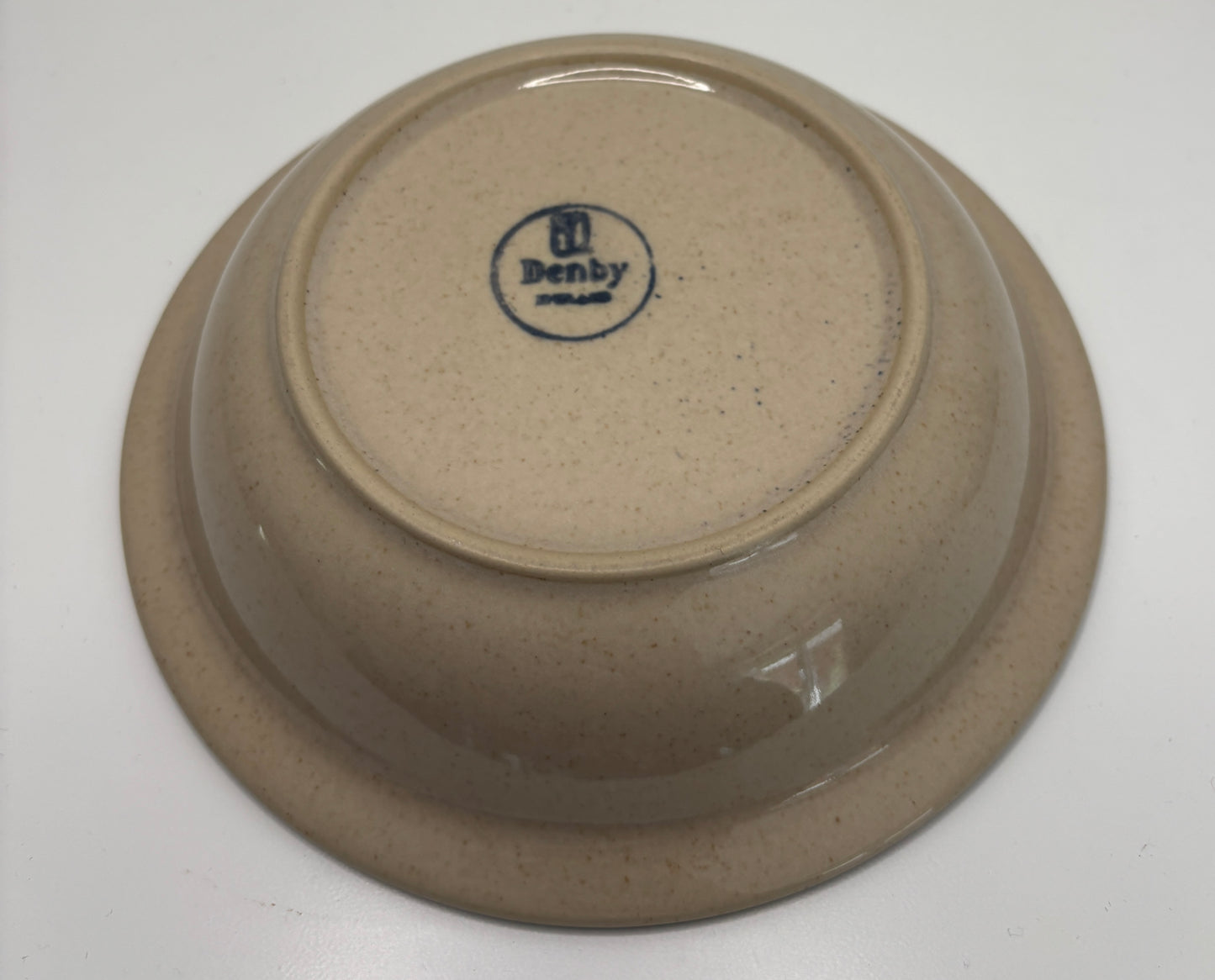 Brown ceramic bowl with 'Denby' branding on a white background