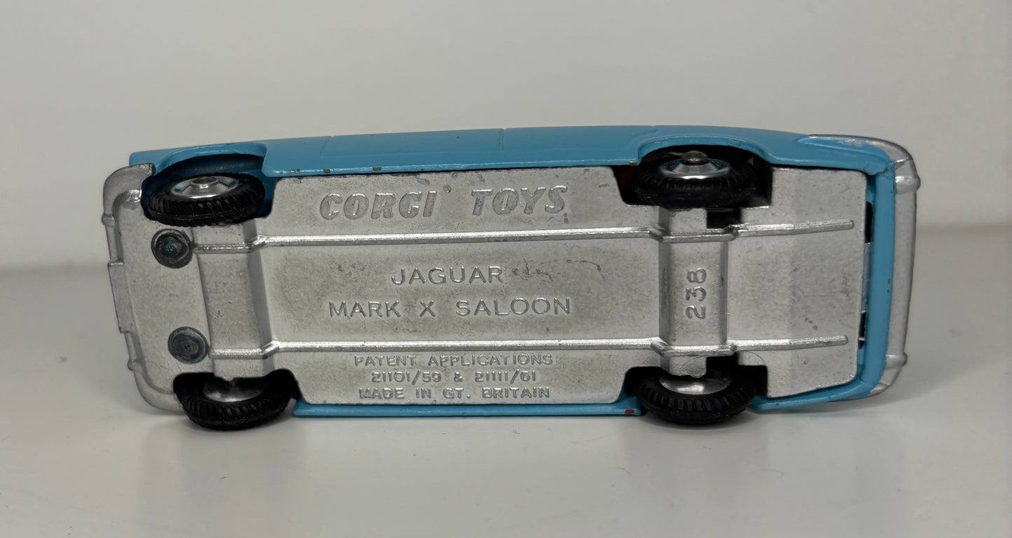 Model car toy with 'Corgi Toys' branding on a gray background