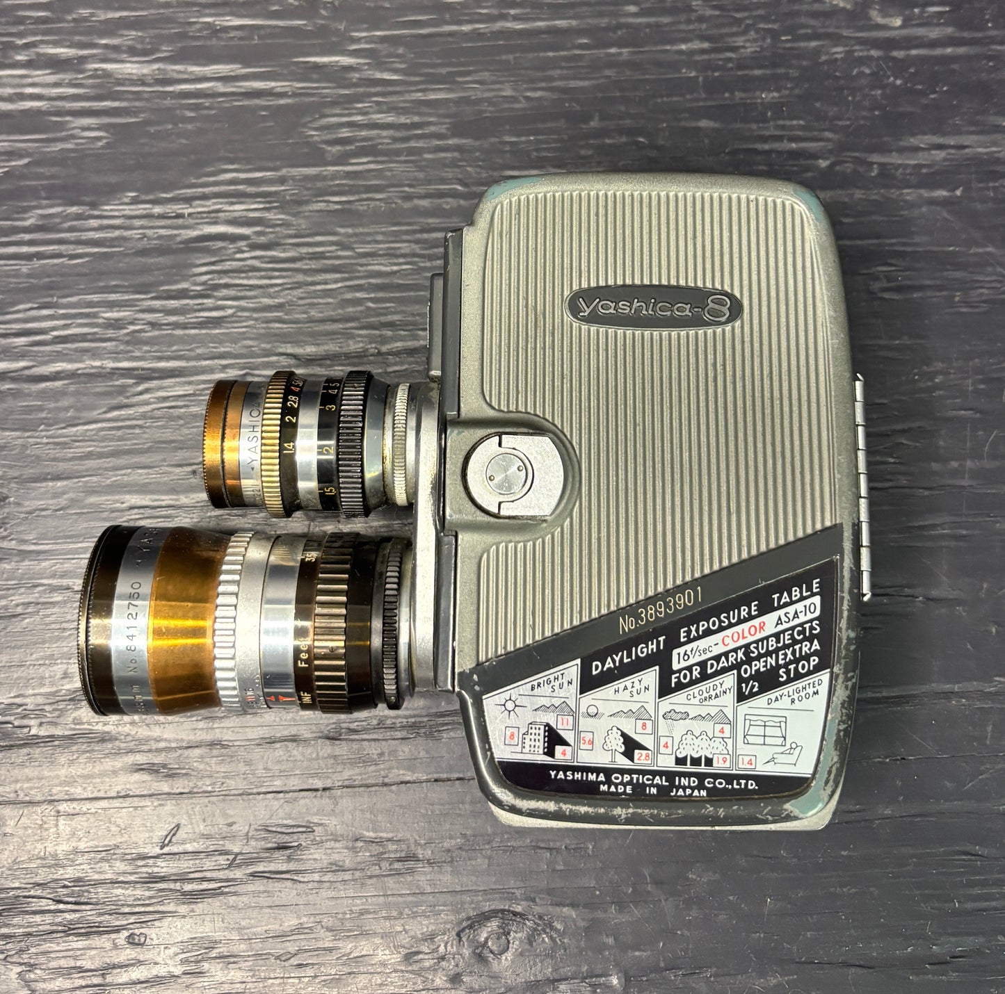 Vintage Yashica movie camera on a wooden surface