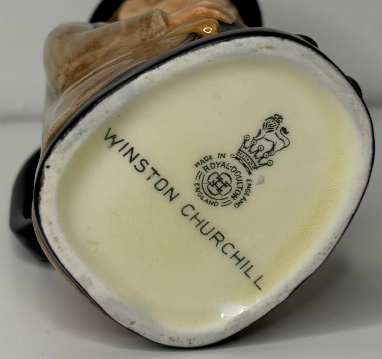 Winston Churchill figurine with a visible brand logo on a plain background