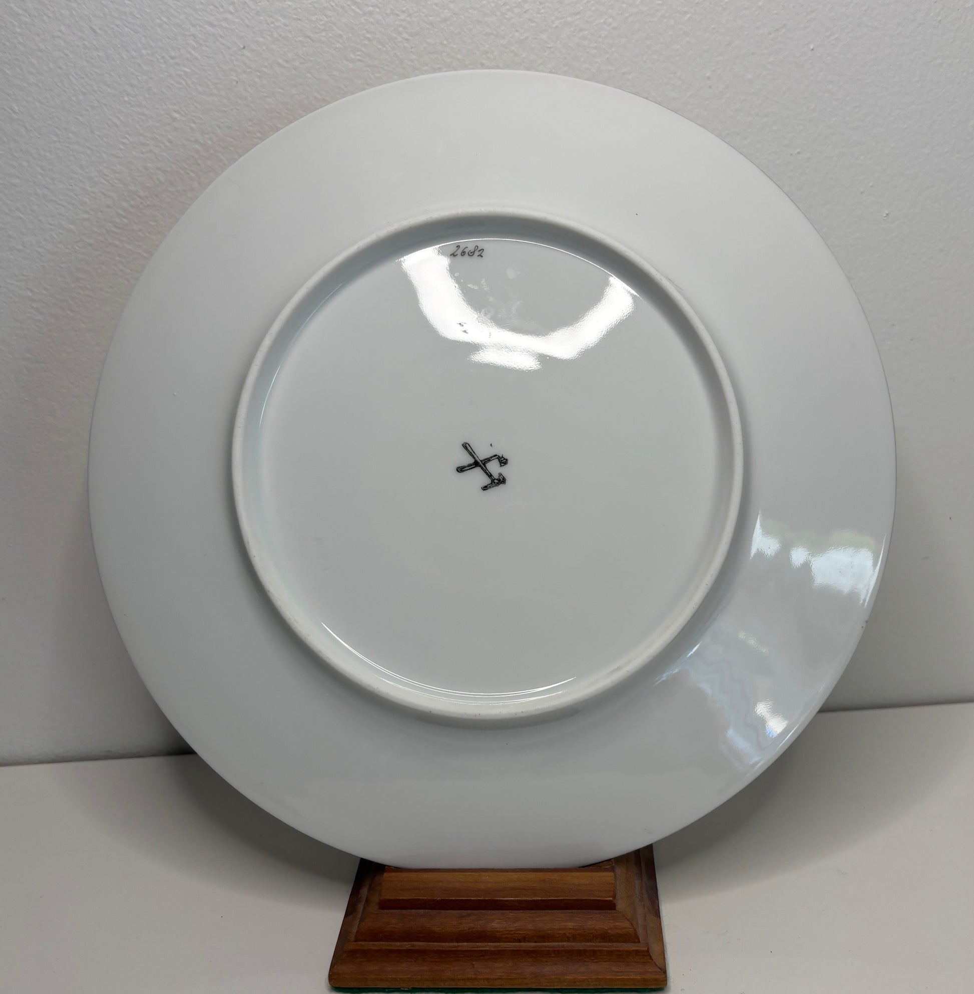 White plate with a logo on a white background