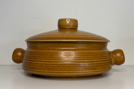 Brown ceramic pot with lid on a white background