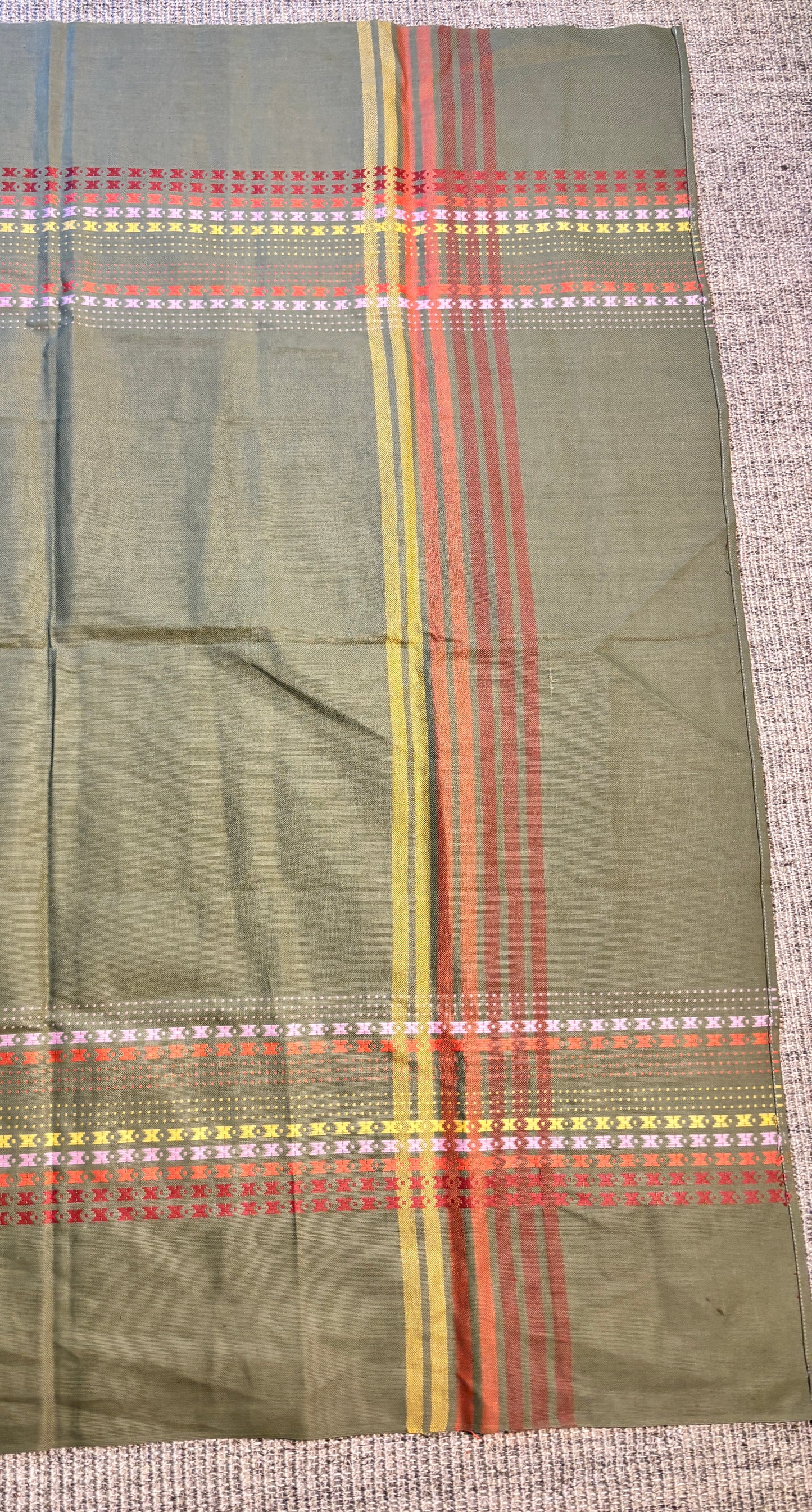 Plaid fabric with green background and multicolor stripes