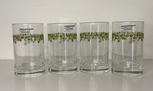 Four Corolle tumblers with green floral design on a white background