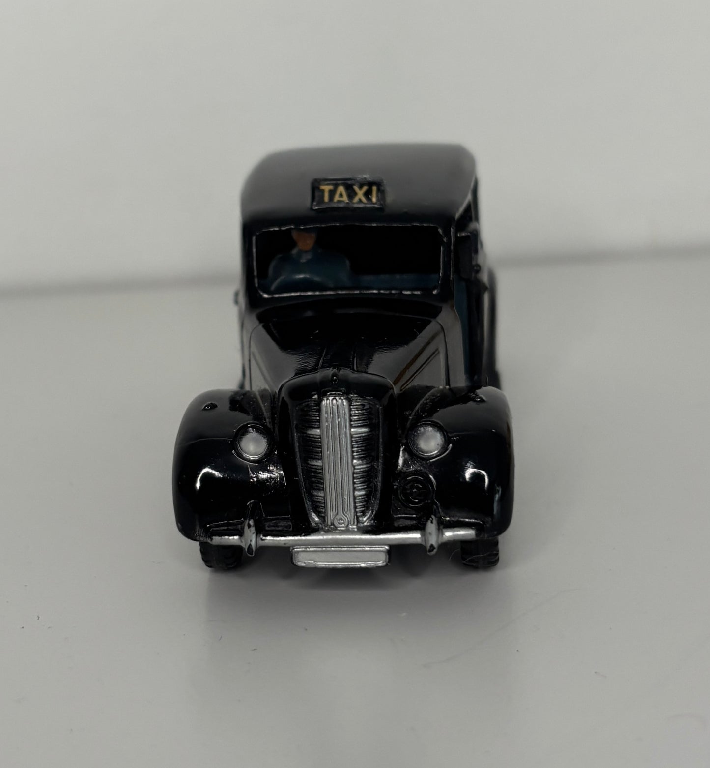 Model of a vintage taxi on a gray background