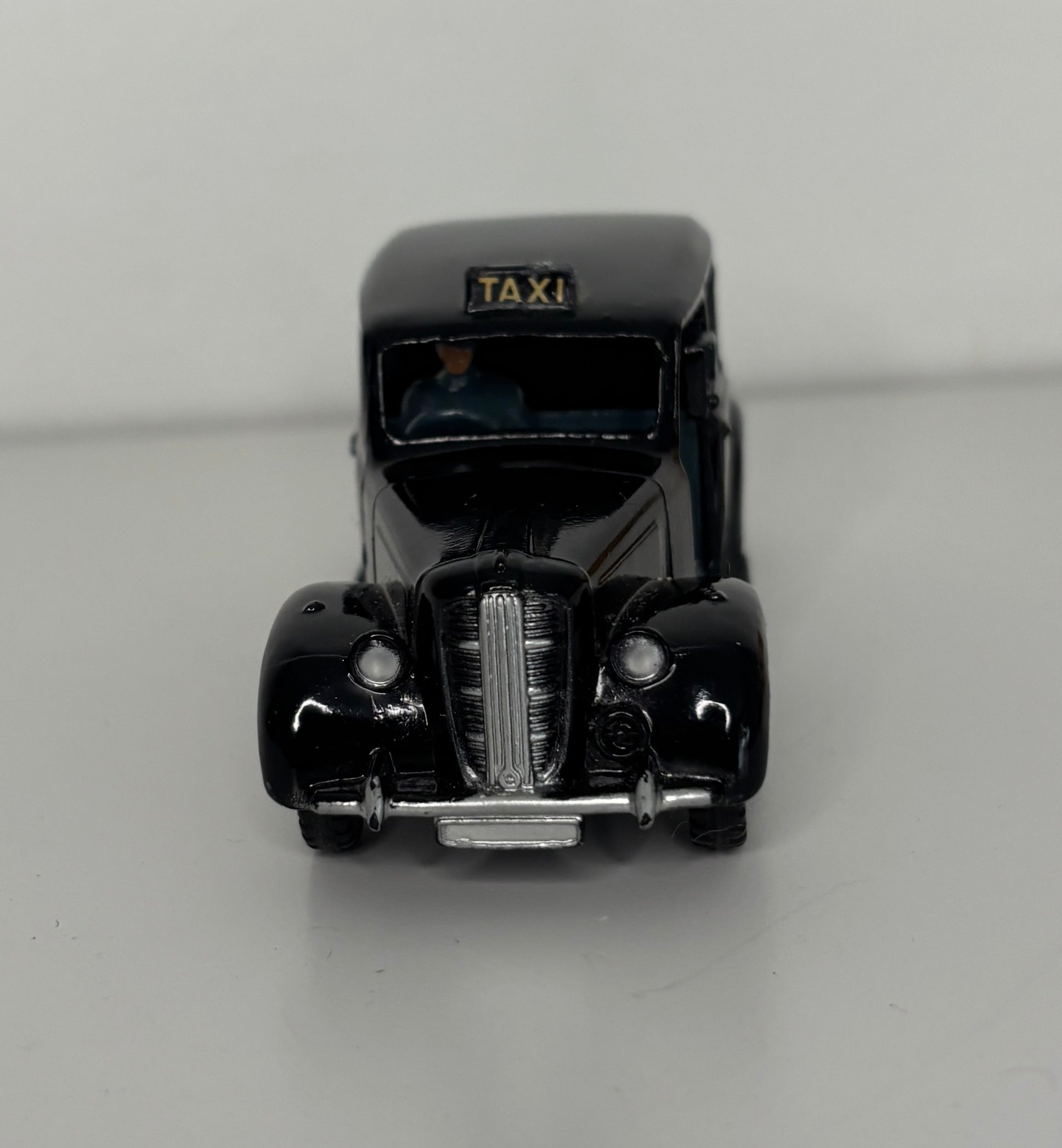 Model of a vintage taxi on a gray background