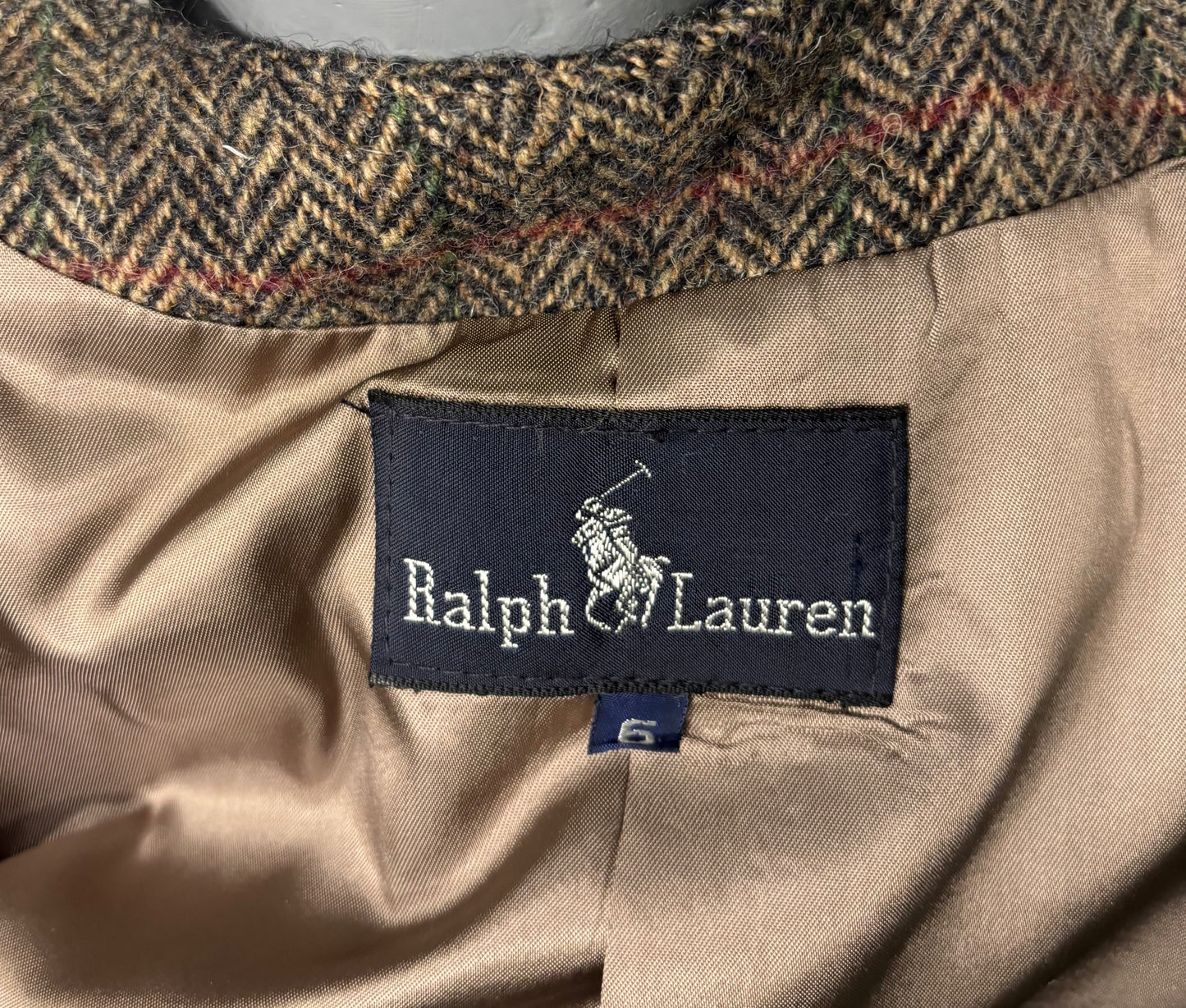 Ralph Lauren label on a beige fabric with a plaid collar