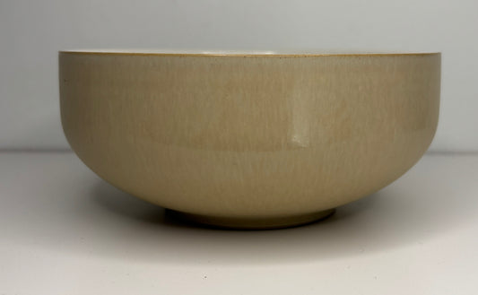 Beige ceramic bowl on a white background