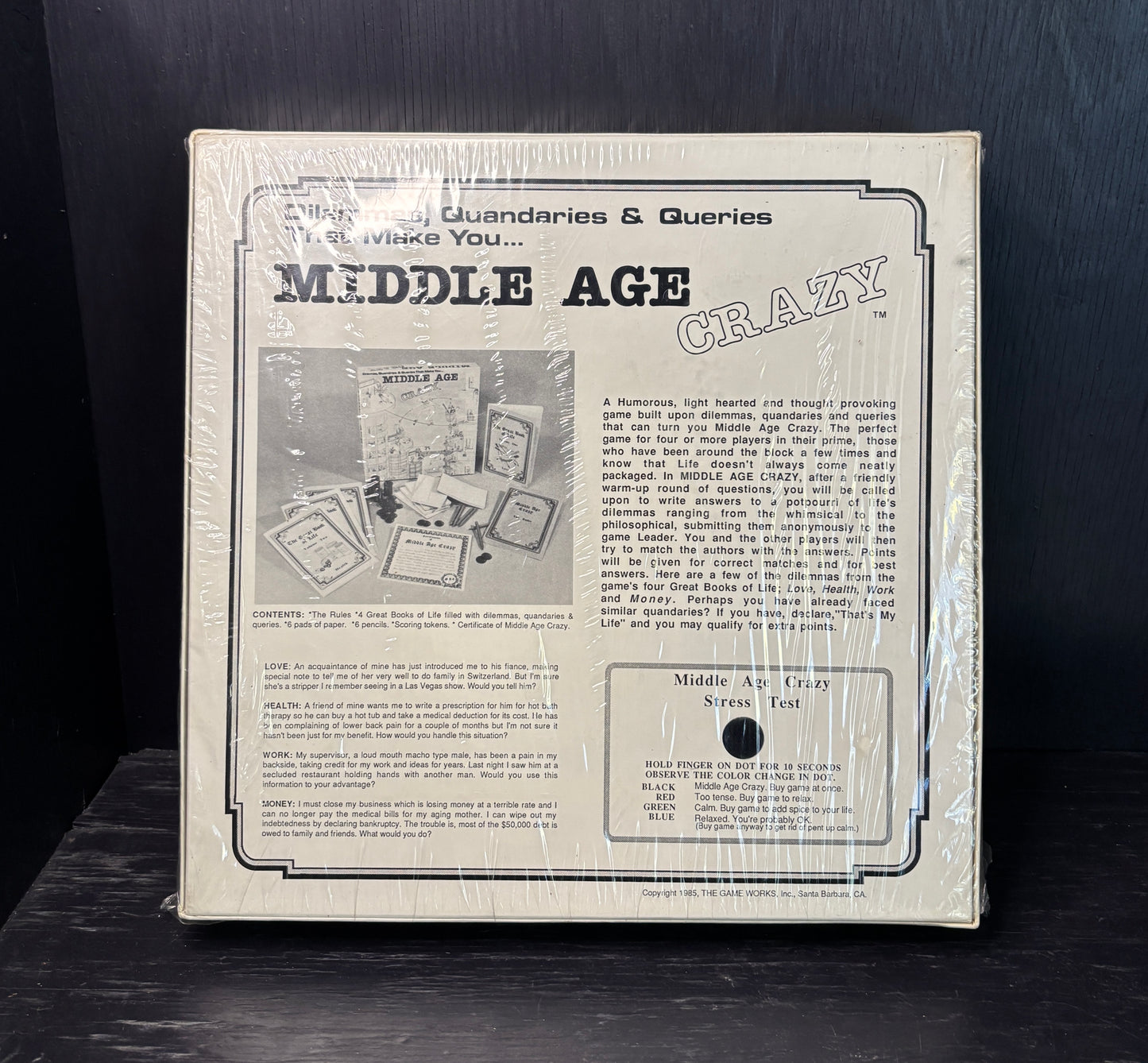 Product packaging for 'Middle Age Crazy' with text and images on a dark background