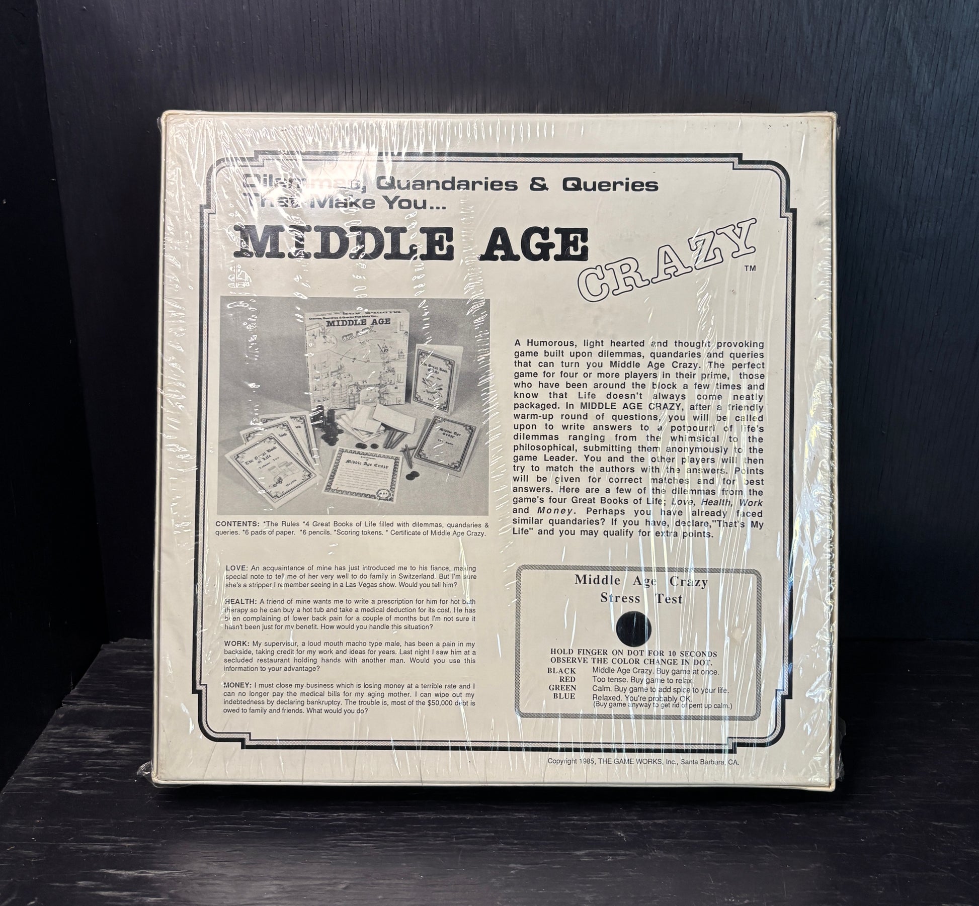Product packaging for 'Middle Age Crazy' with text and images on a dark background