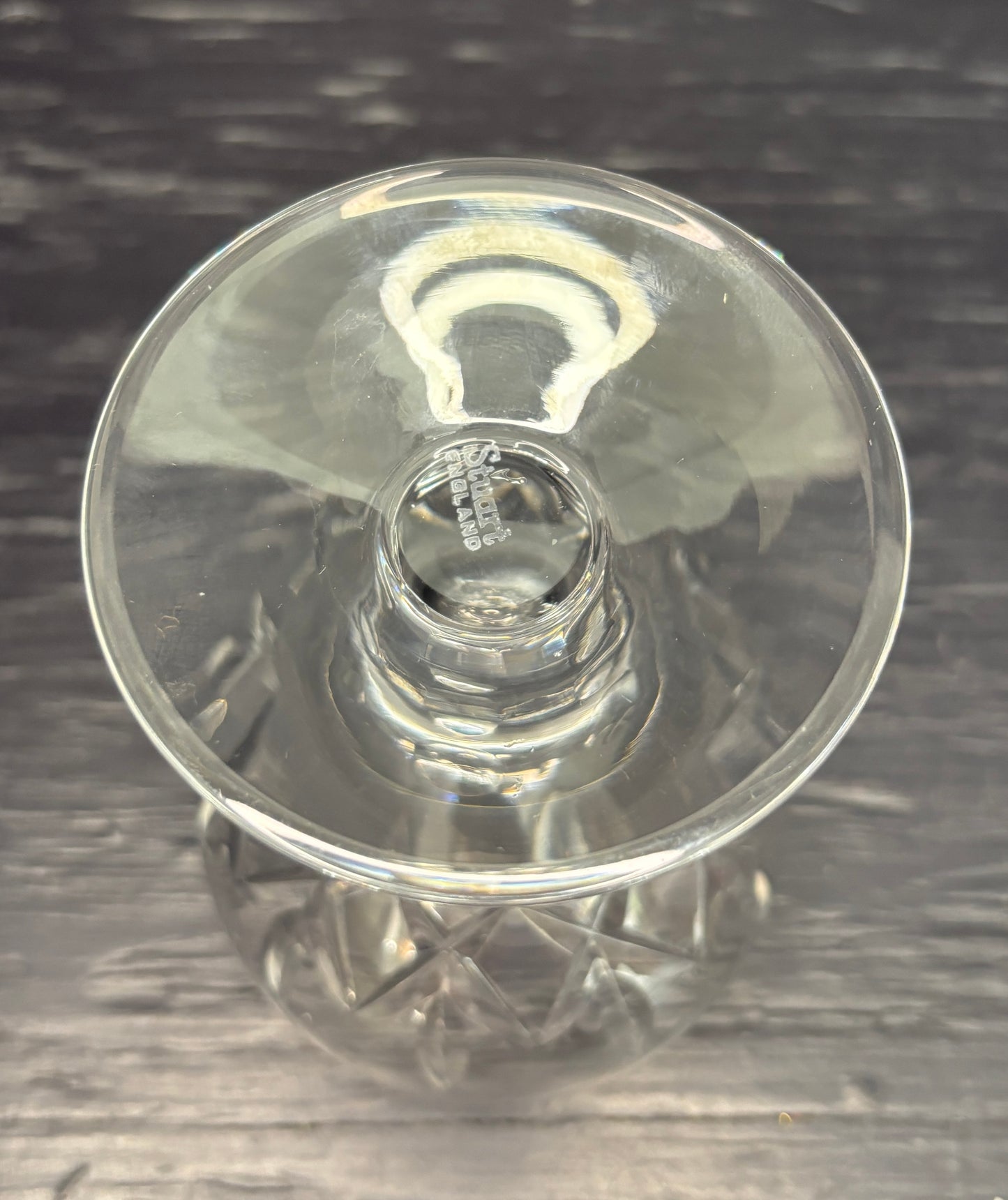 Clear glass stemware on a dark textured surface