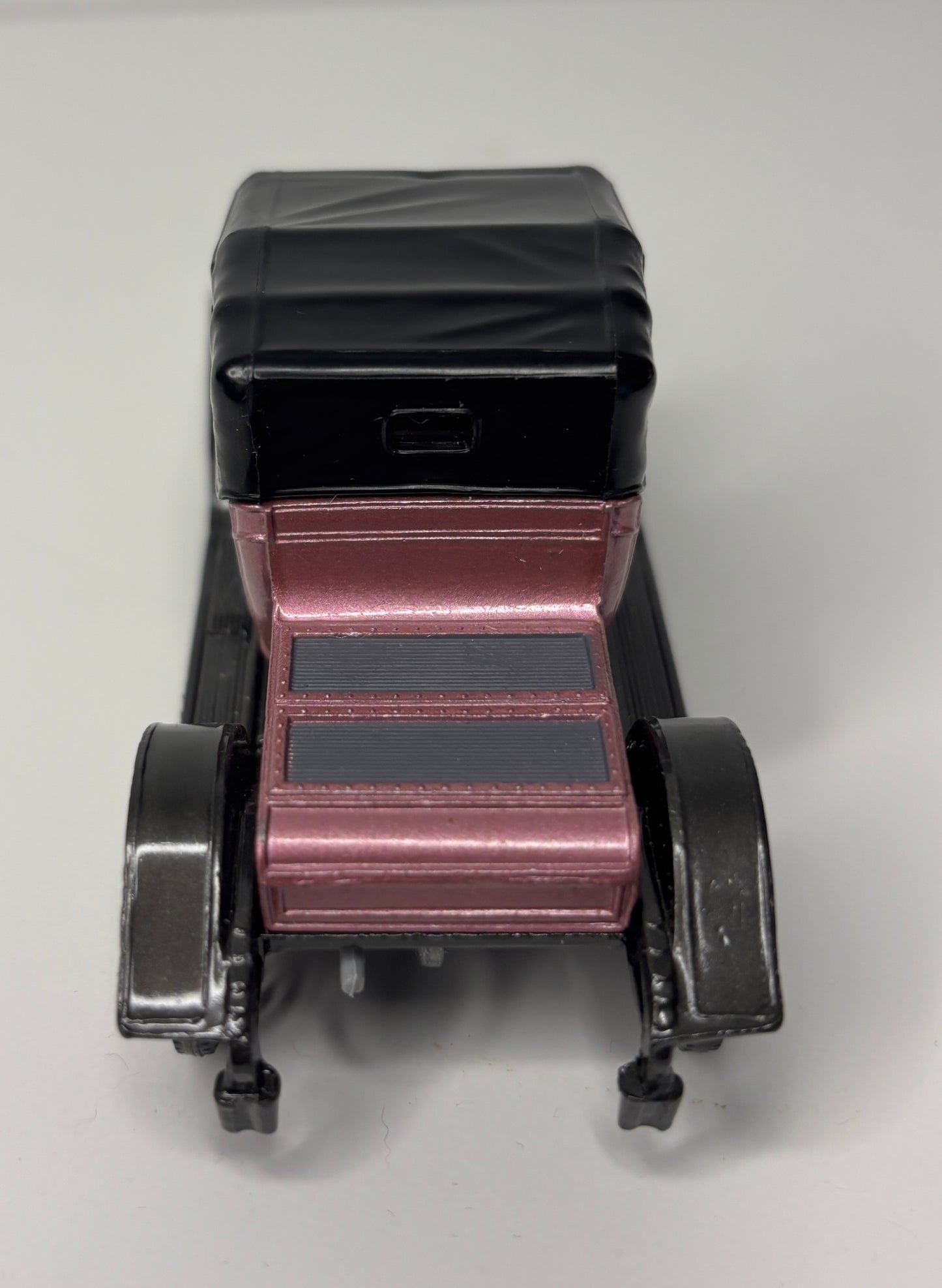 Model of an old-fashioned car on a white background