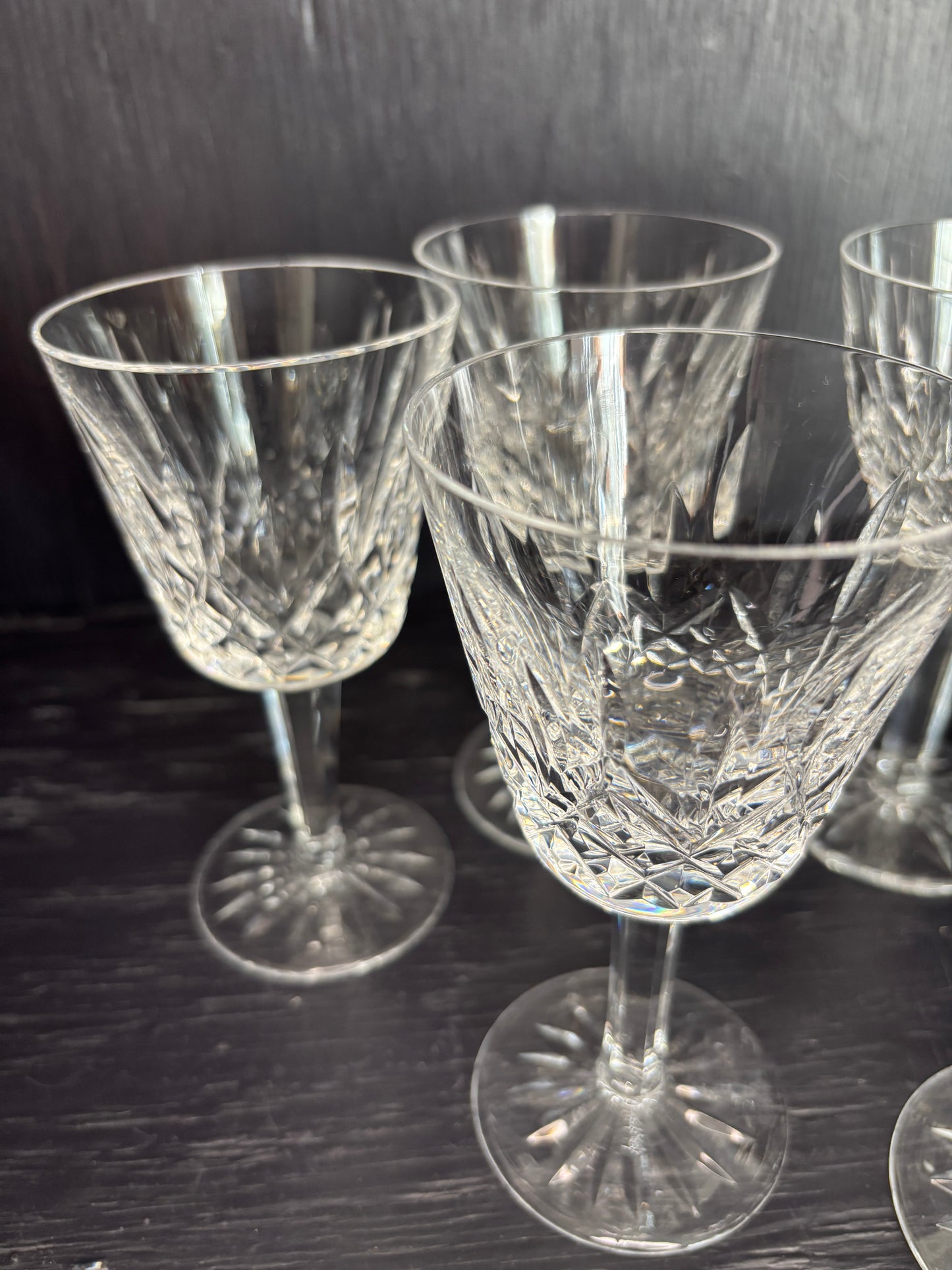 Set of crystal glasses on a dark surface