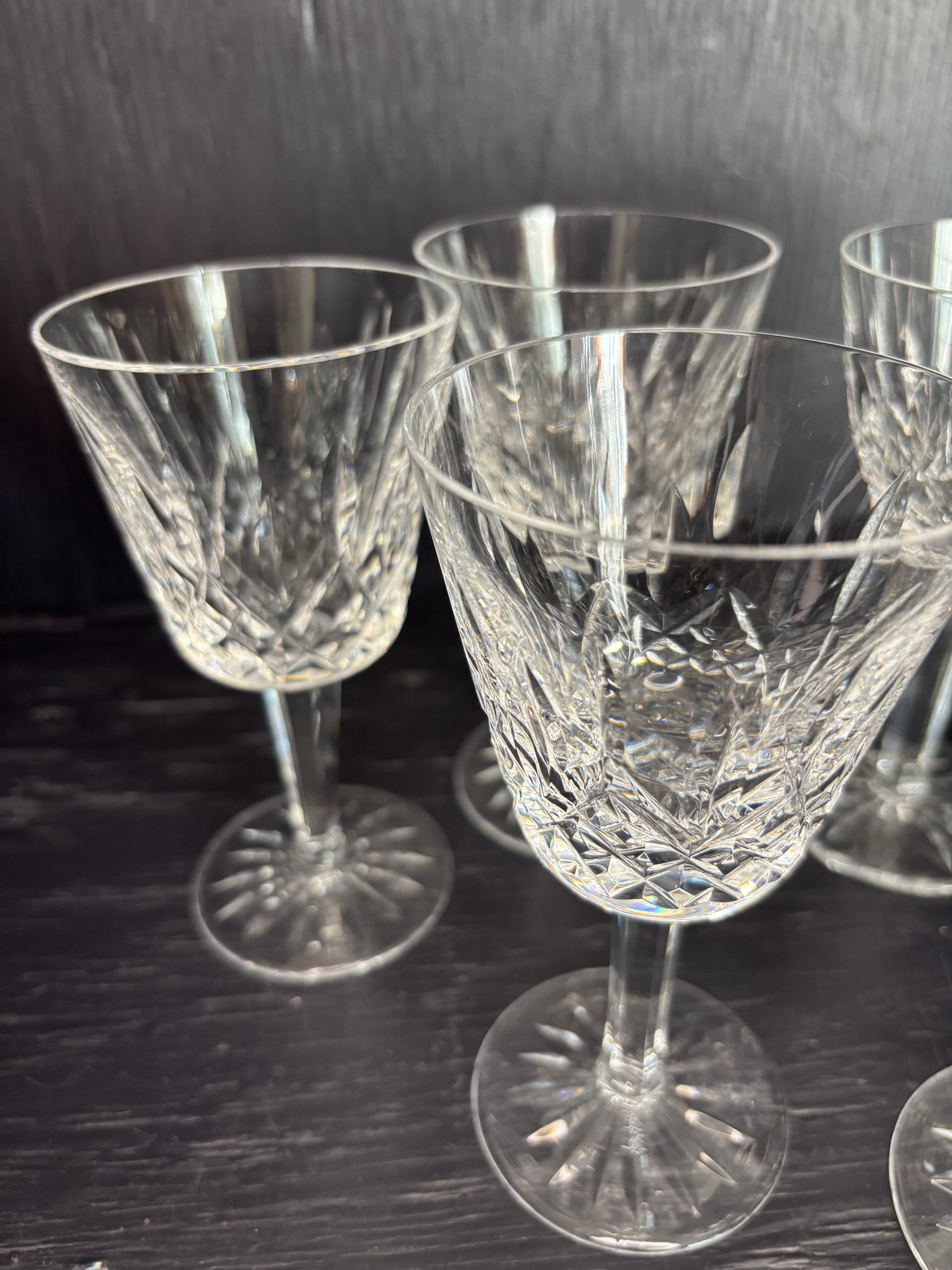 Set of crystal glasses on a dark surface