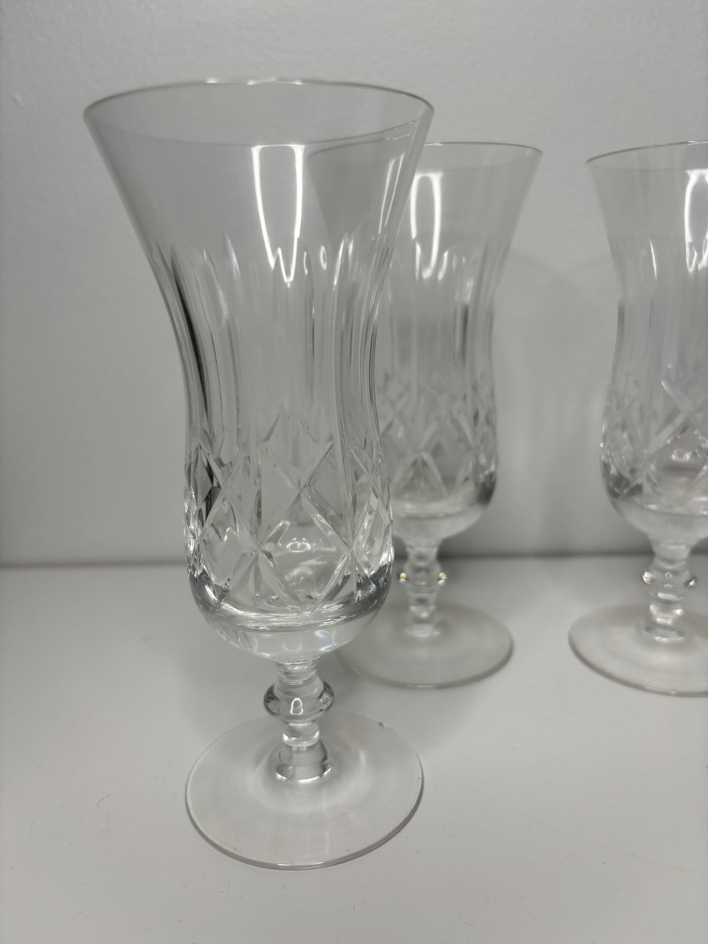 Two crystal glasses on a white surface