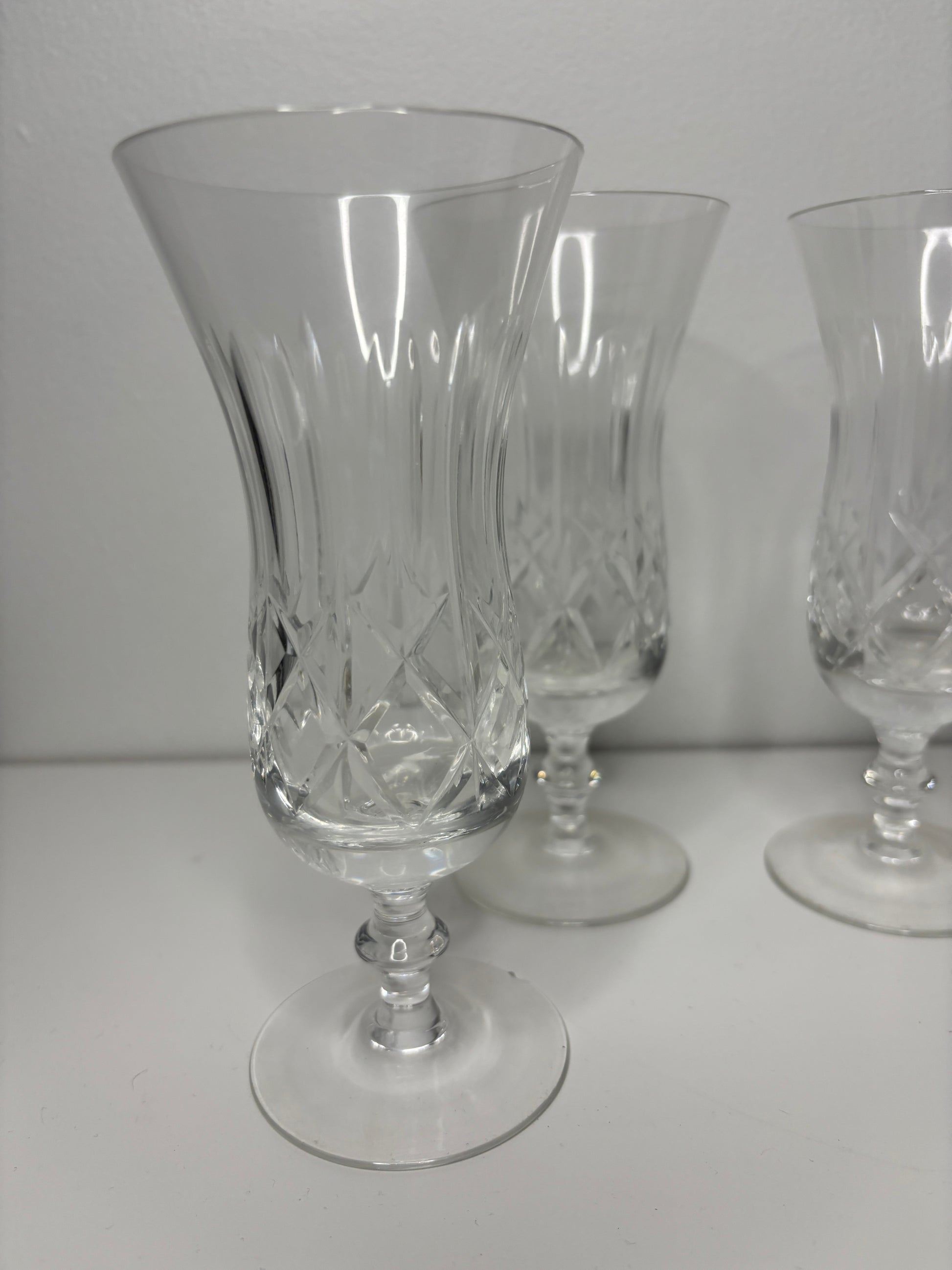 Two crystal glasses on a white surface