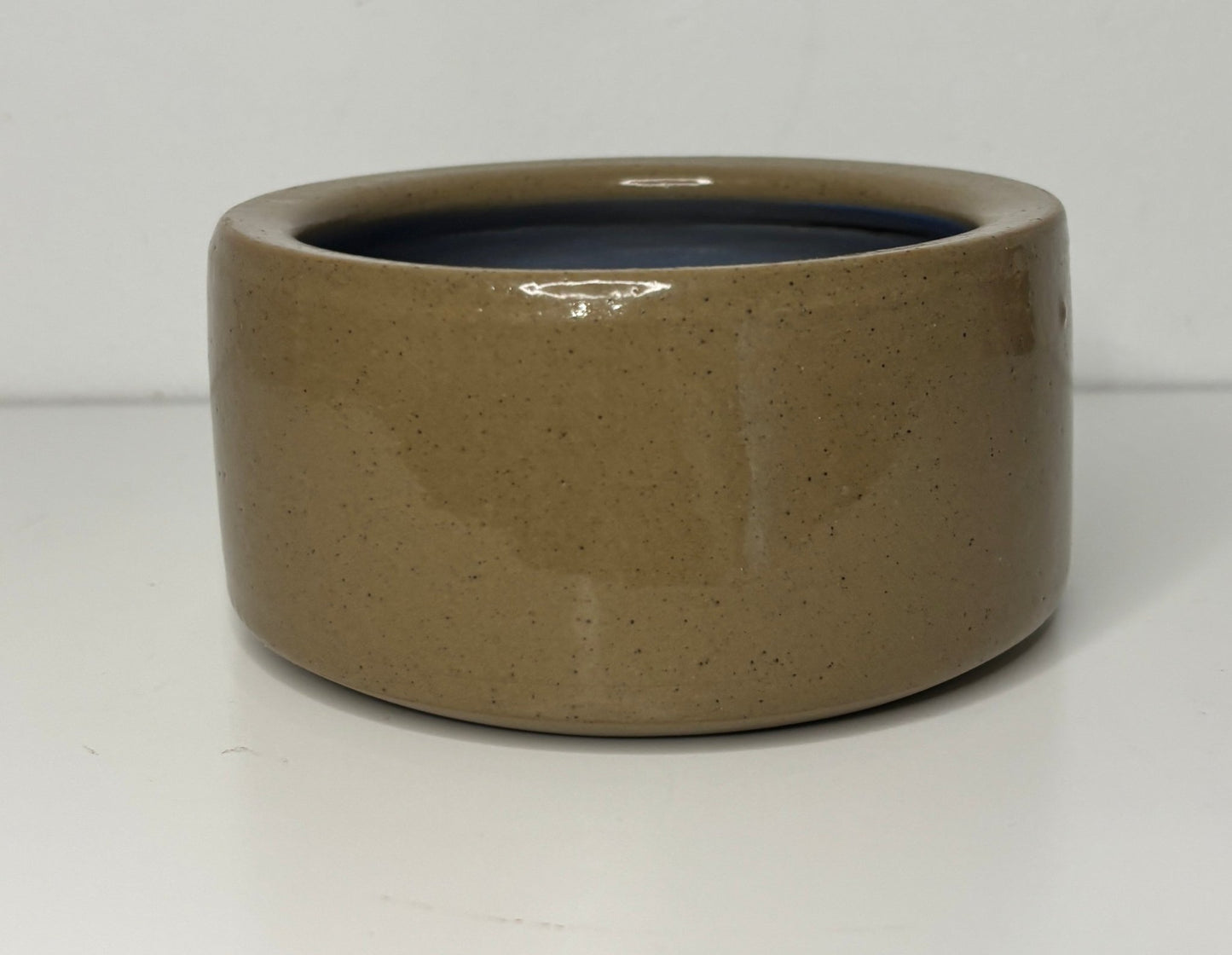 Brown ceramic bowl on a white background