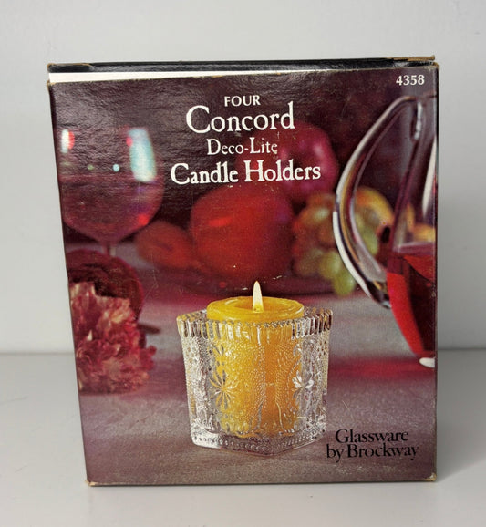 Box of Concord Deco-Lite Candle Holders with a candle and fruit background