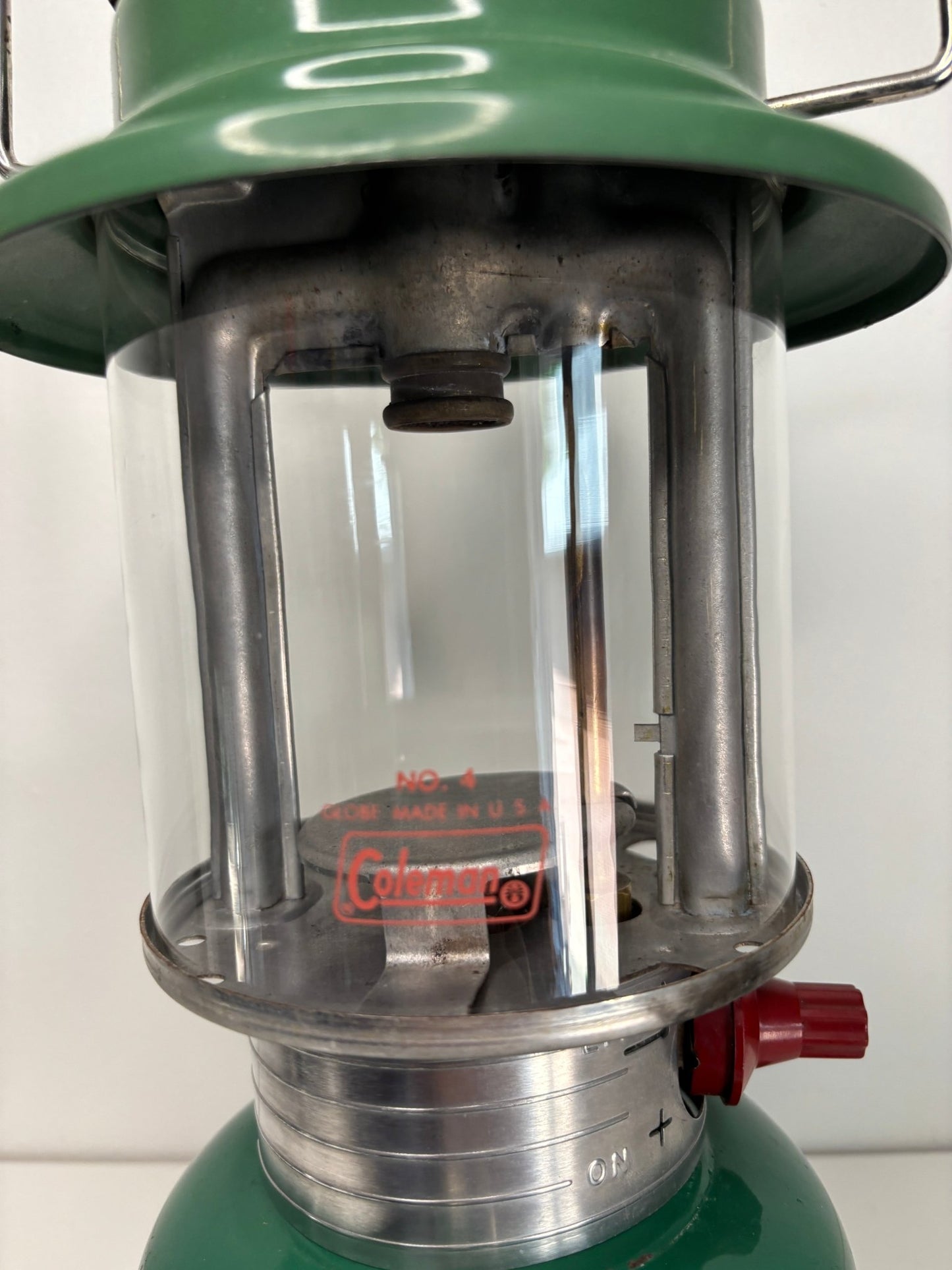 old green Coleman Camping Lantern