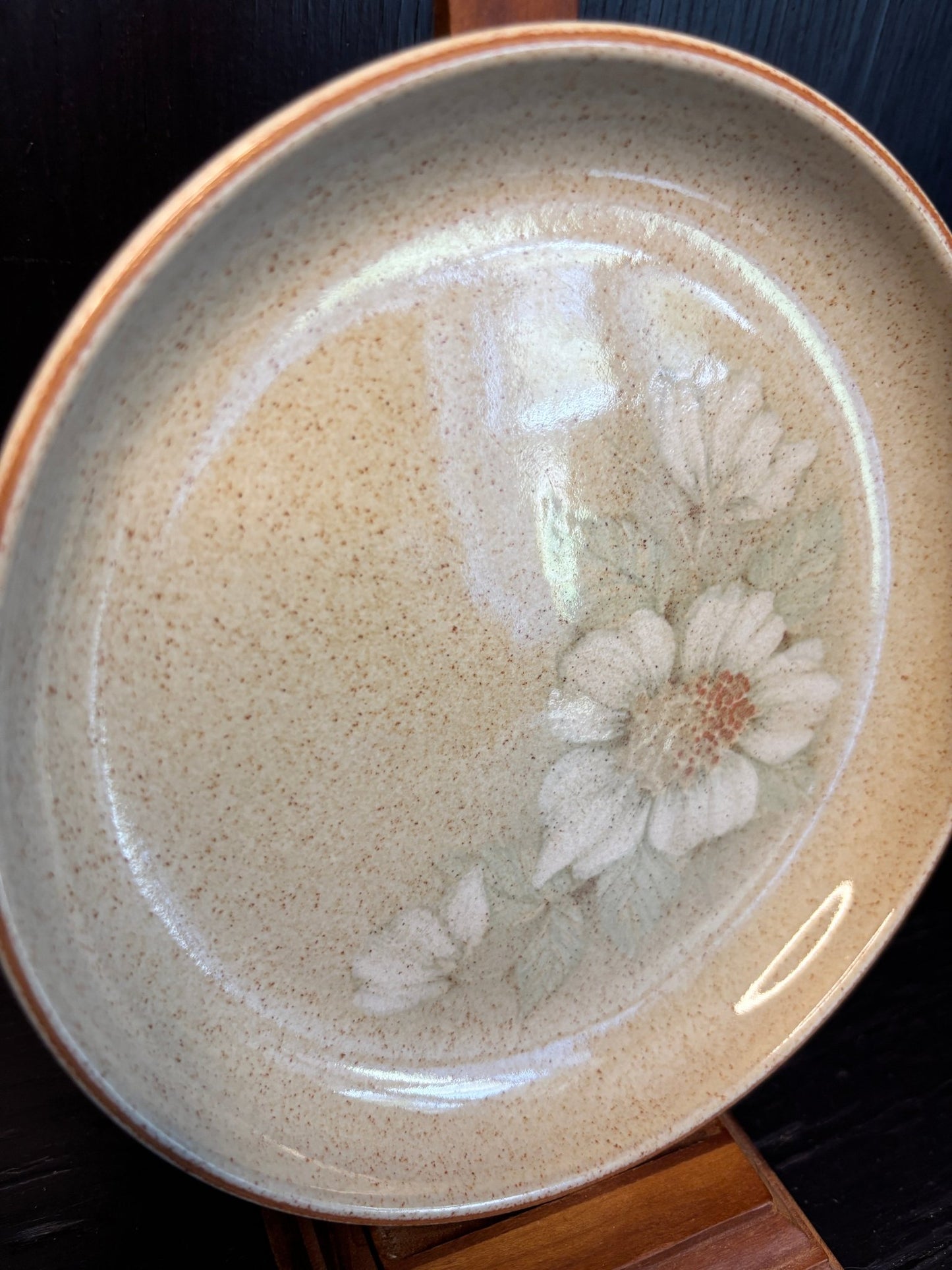 Denby Daybreak Bread Plate with a beige background and white flower motif