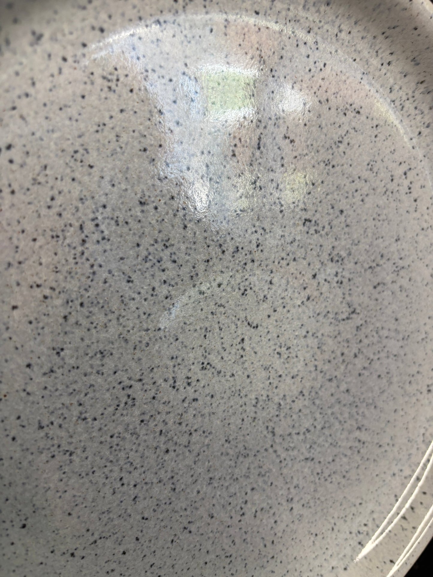 Close-up of a speckled gray ceramic plate