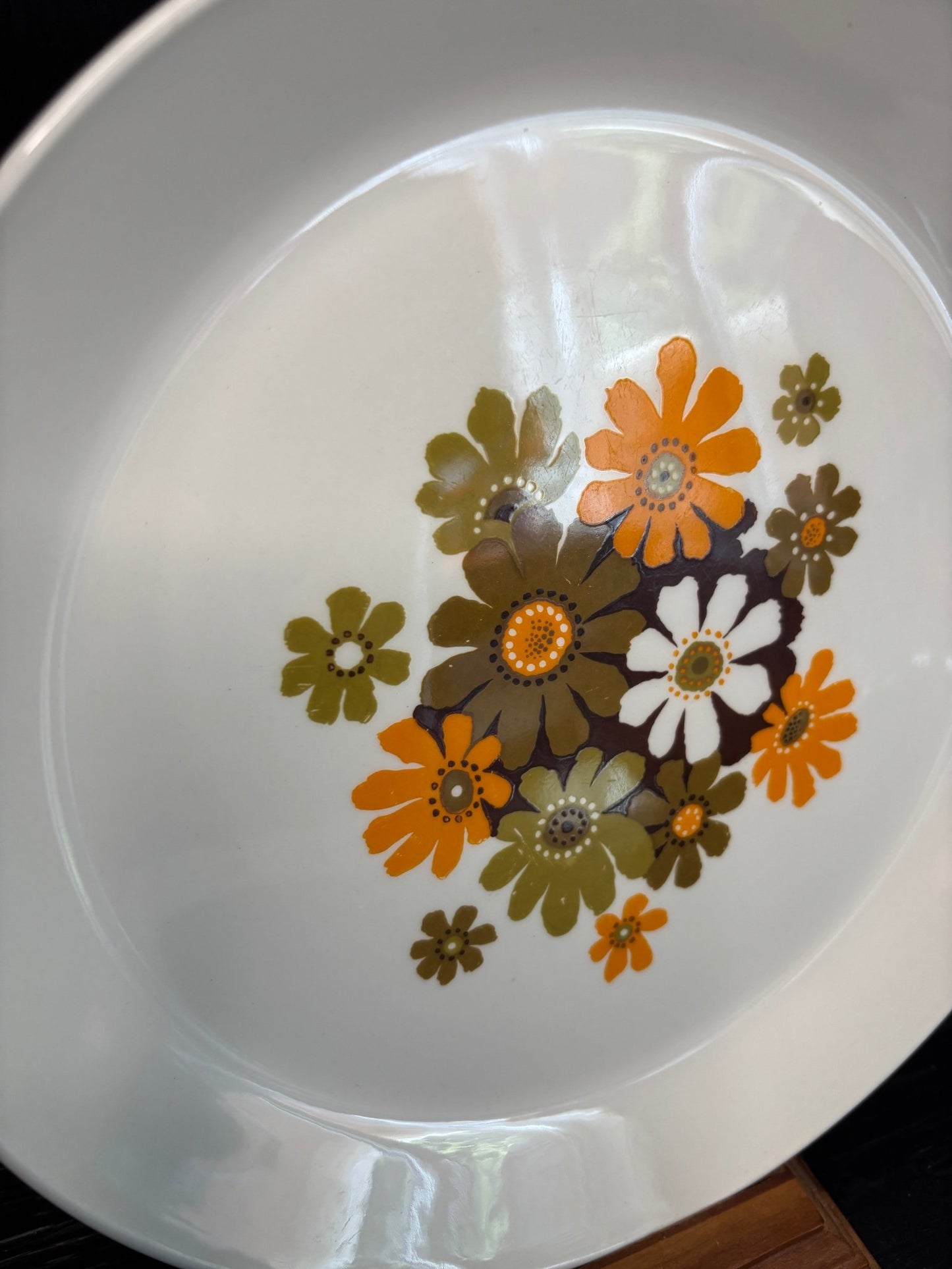 White plate with floral pattern on a white background