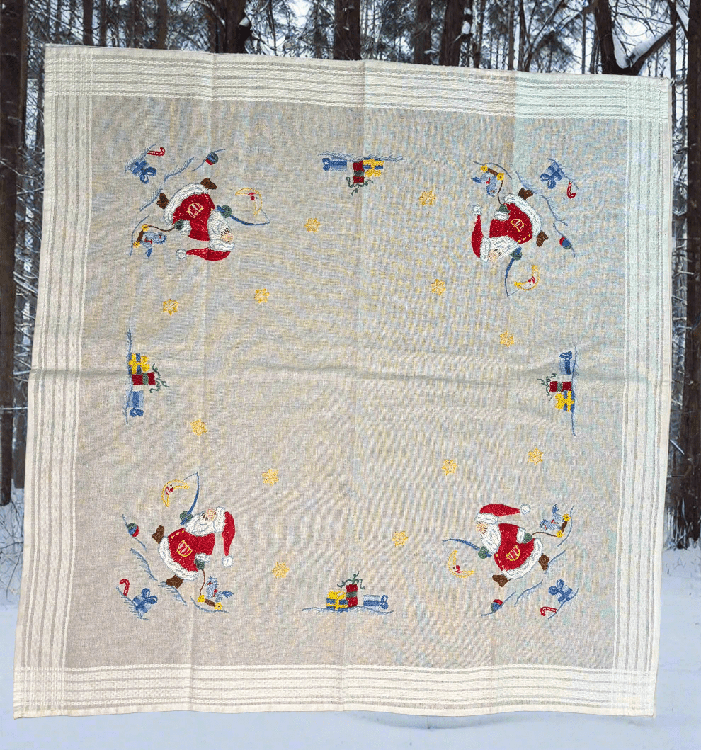 Quilt with Santa Claus design in a snowy outdoor setting