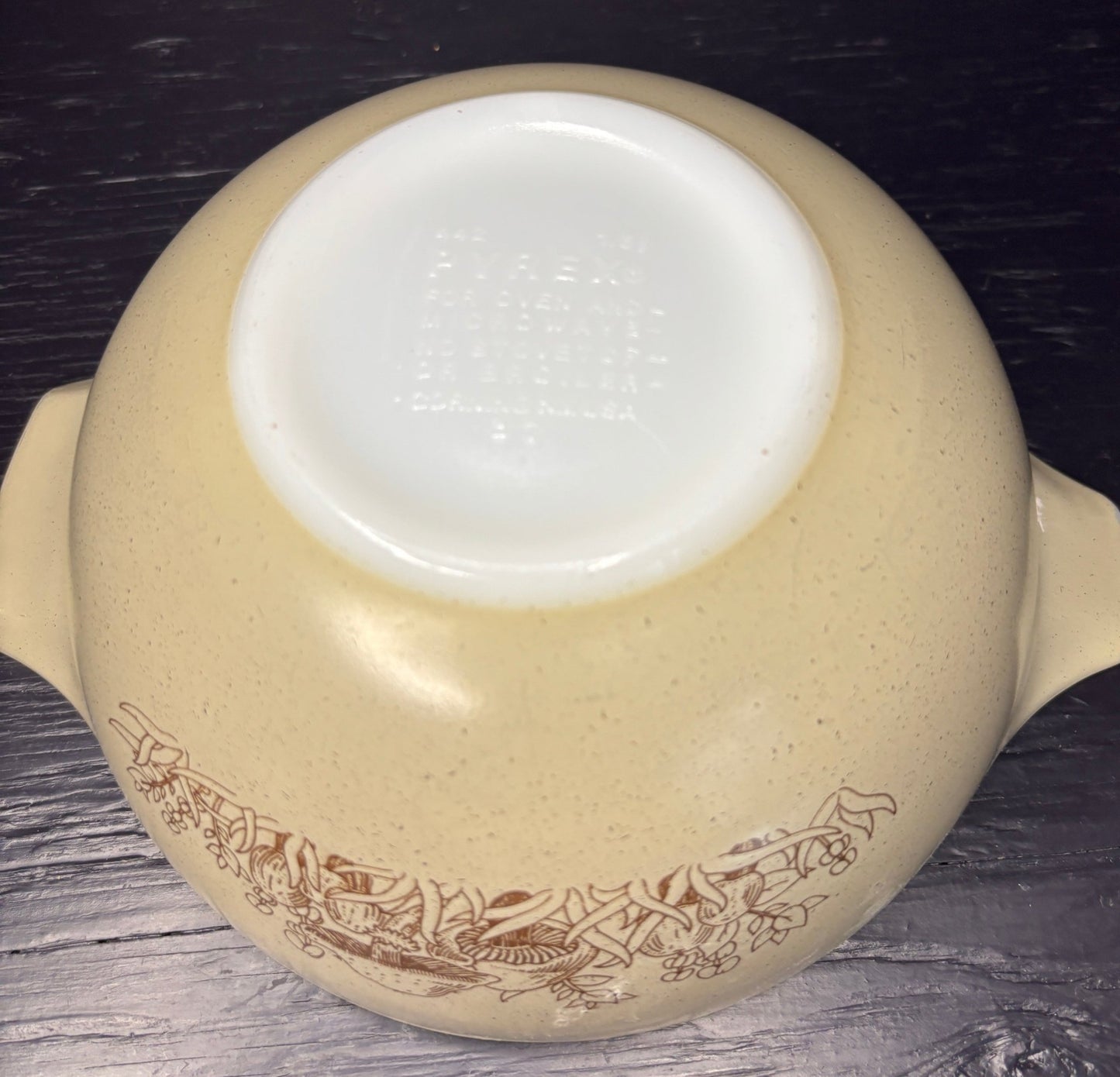 beige and brown Pyrex Forest Fancies 1.5 Quart Cinderella Mixing Bowl with mushroom design