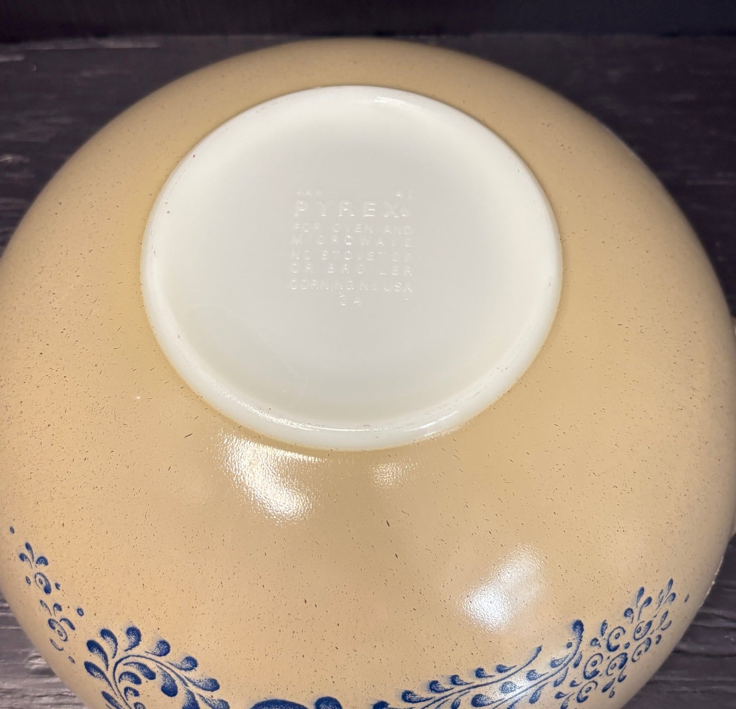 beige and white Pyrex Homestead Mixing Bowl with blue flower design