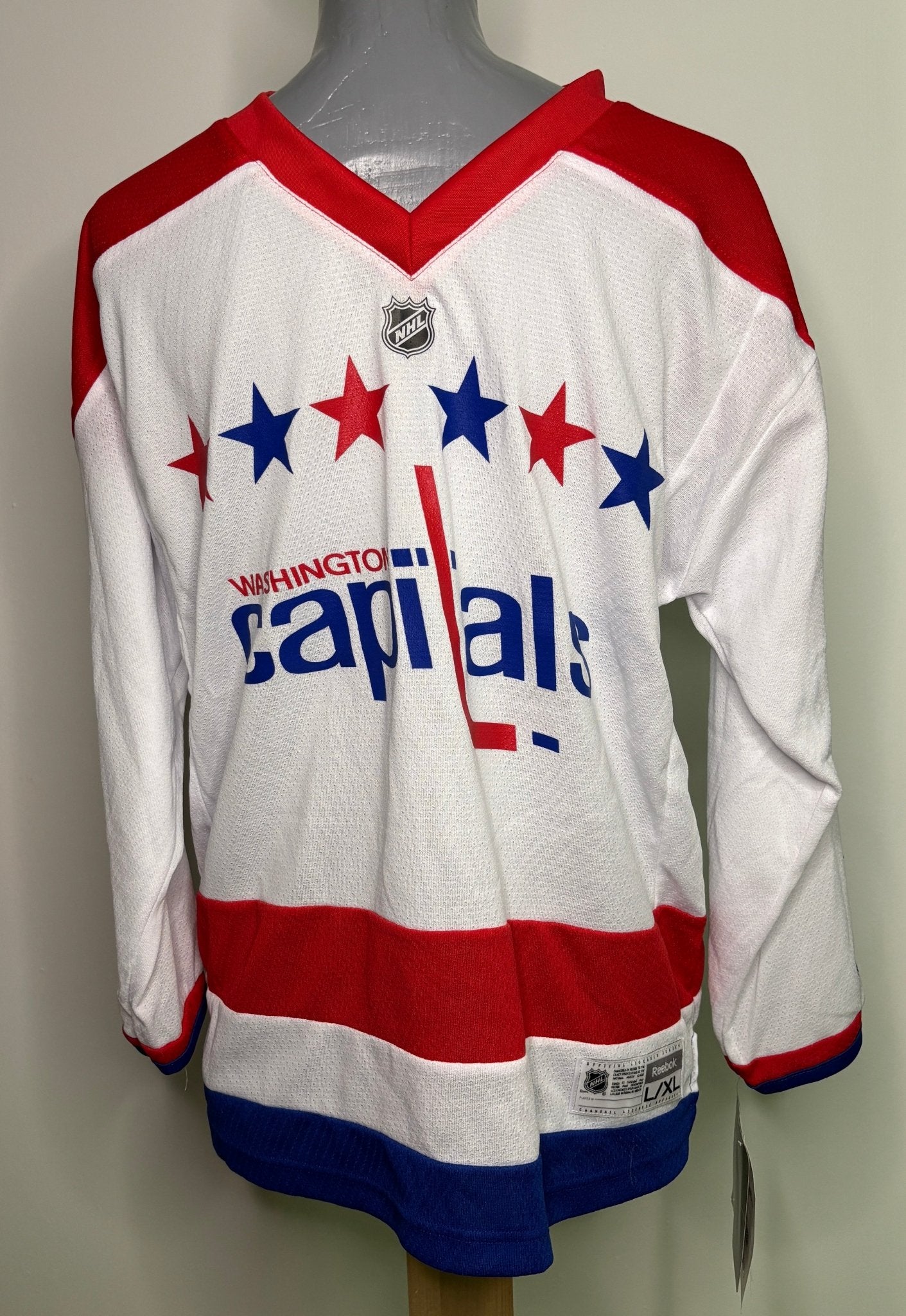 Washington Capitals hockey jersey on a mannequin against a white background