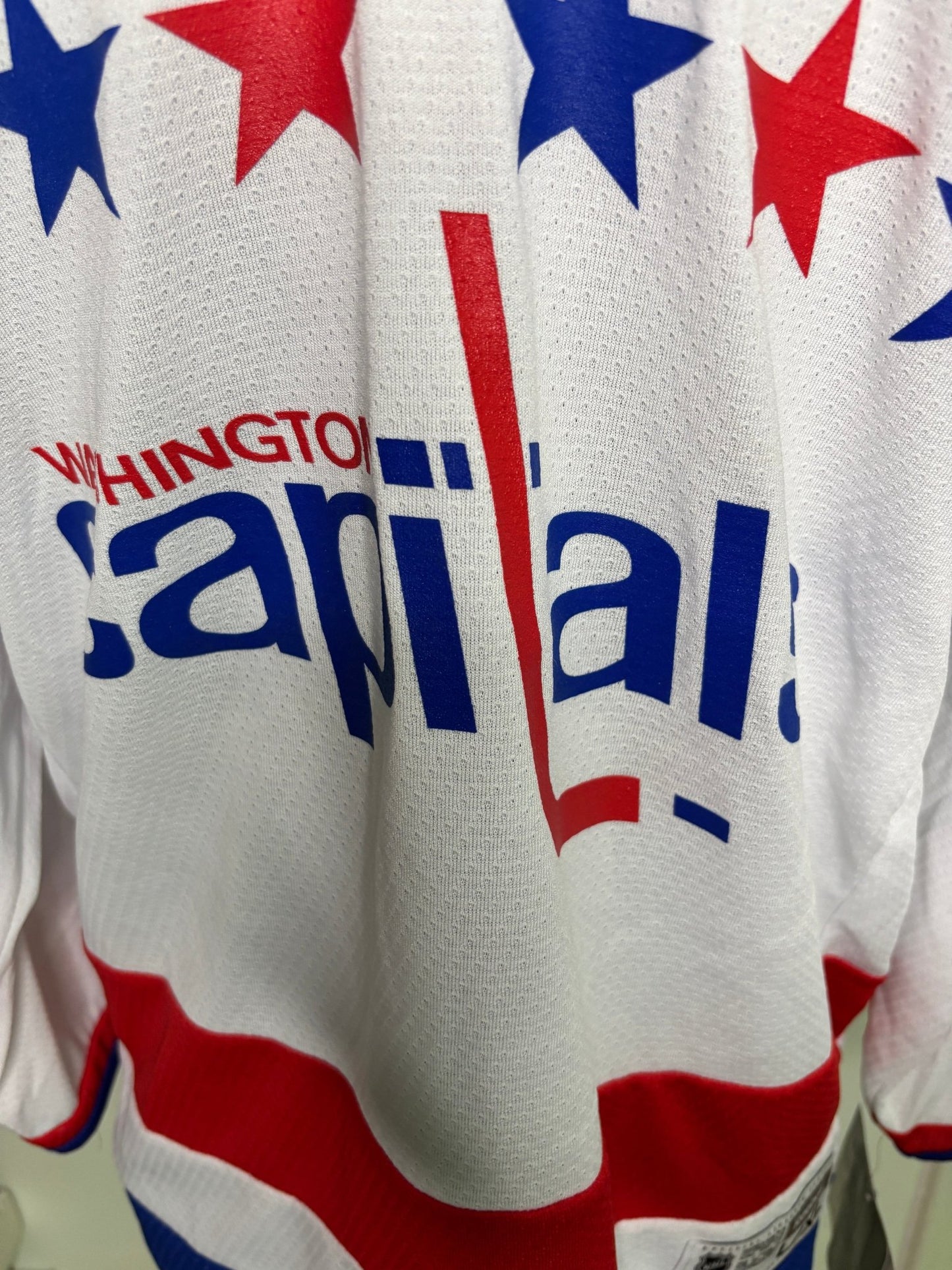 Washington Nationals sports team jersey with red, white, and blue design.