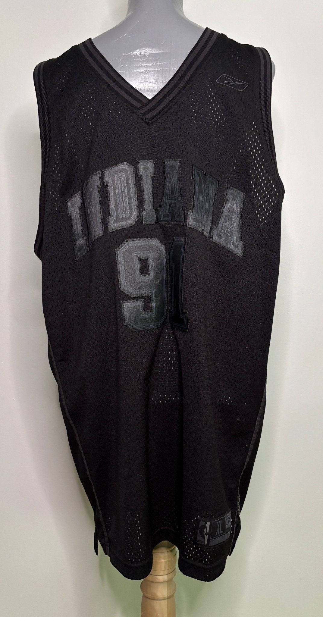 Black basketball jersey with 'Indiana' and number '9' on a mannequin against a white background