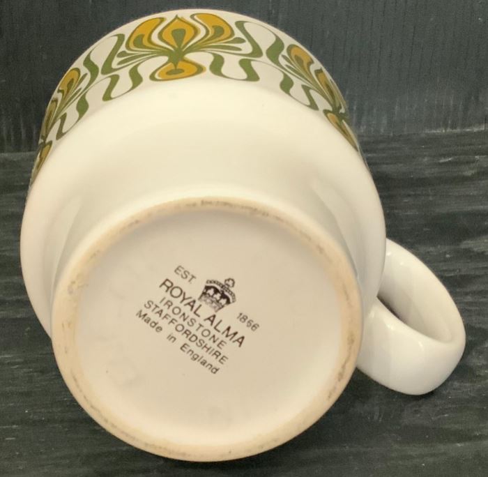 Royal Alma Coffee Mug with green and yellow geometric swirl design