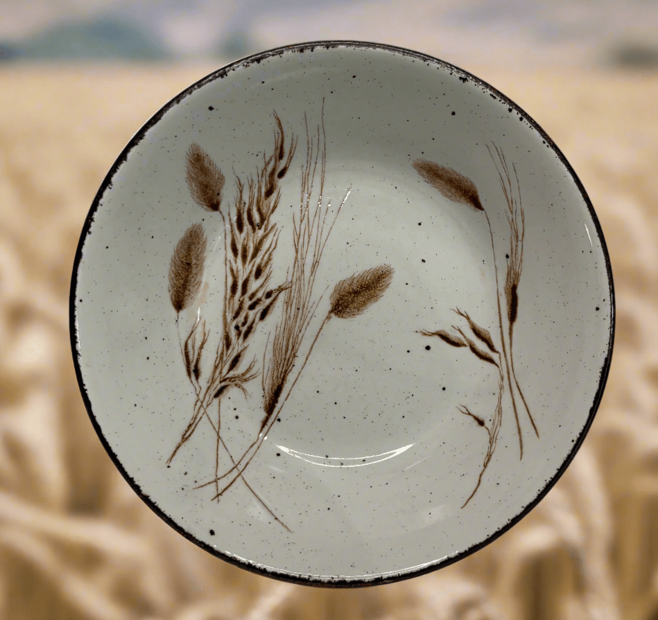 Ceramic plate with wheat design in a field of wheat