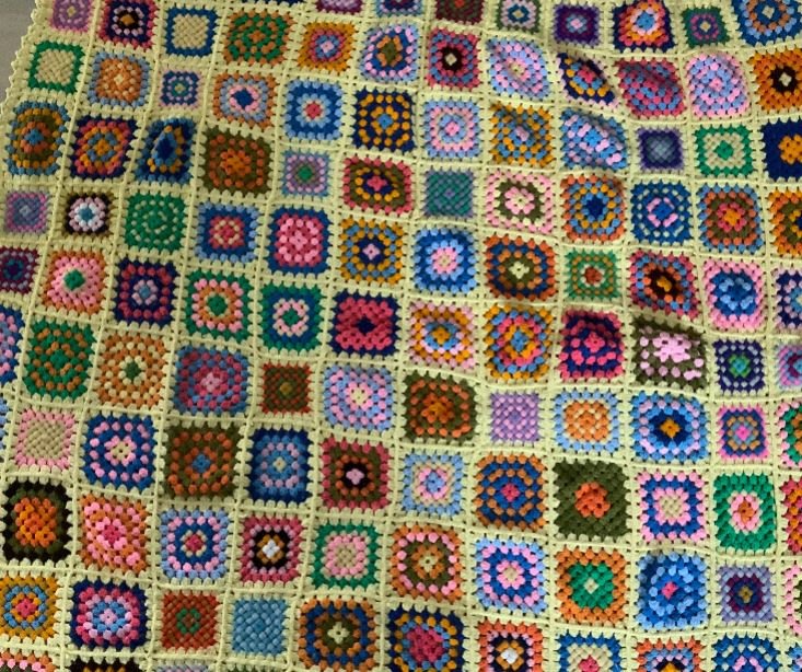 multiple colored granny blanket with squares design that is hand knit wool