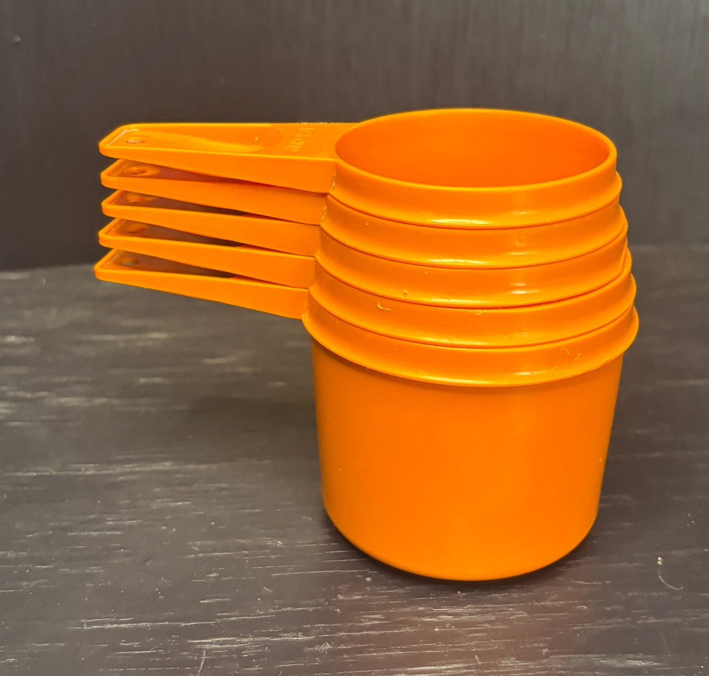 Orange Tupperware Measuring Cups