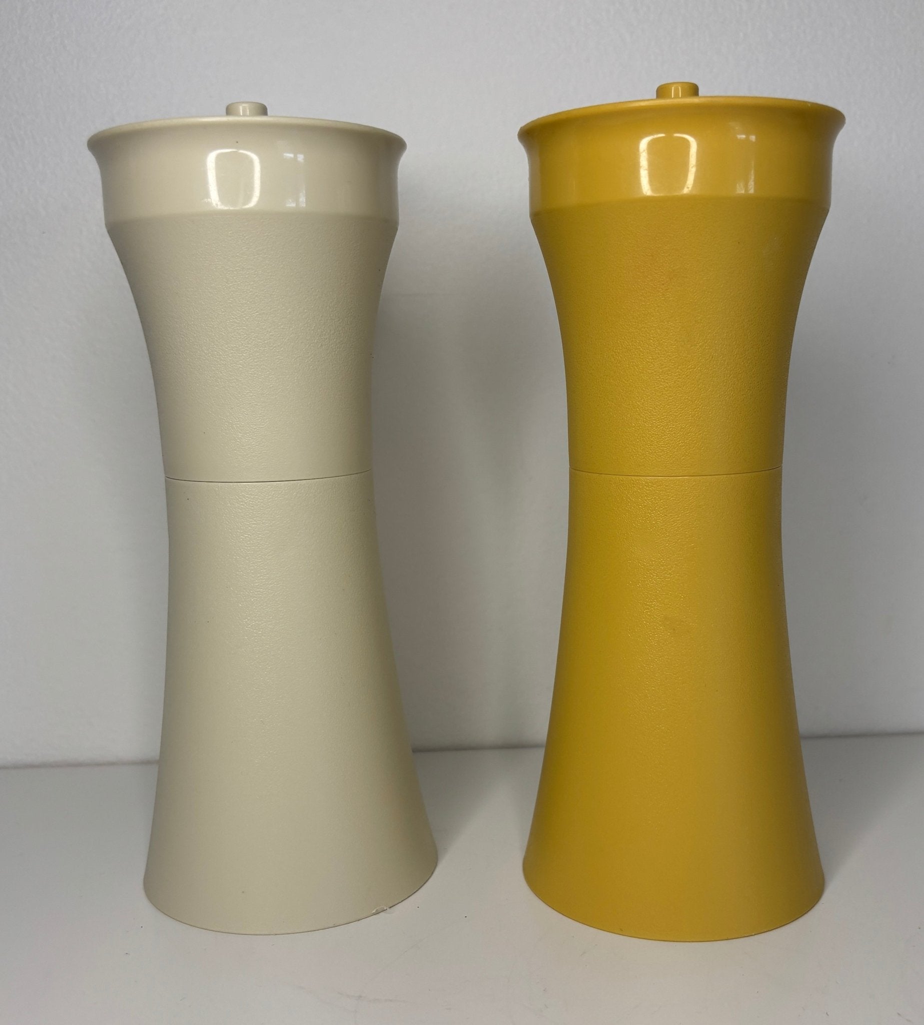 yellow and white Tupperware Salad Dressing Cruets