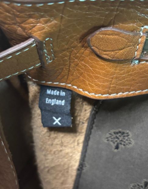 Brown leather product with 'Made in England' label