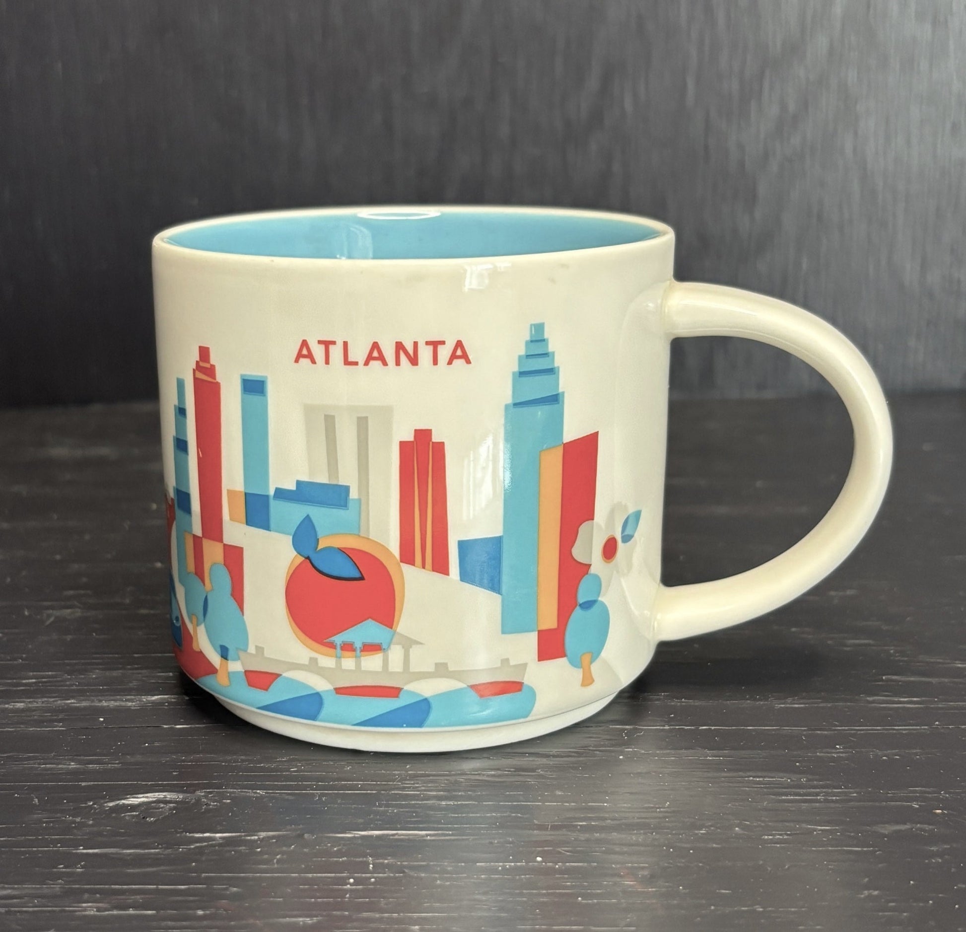 Mug with Atlanta skyline design on a dark surface